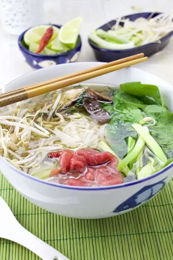 Pho Bo with Spinach and Shiitake In a bowl