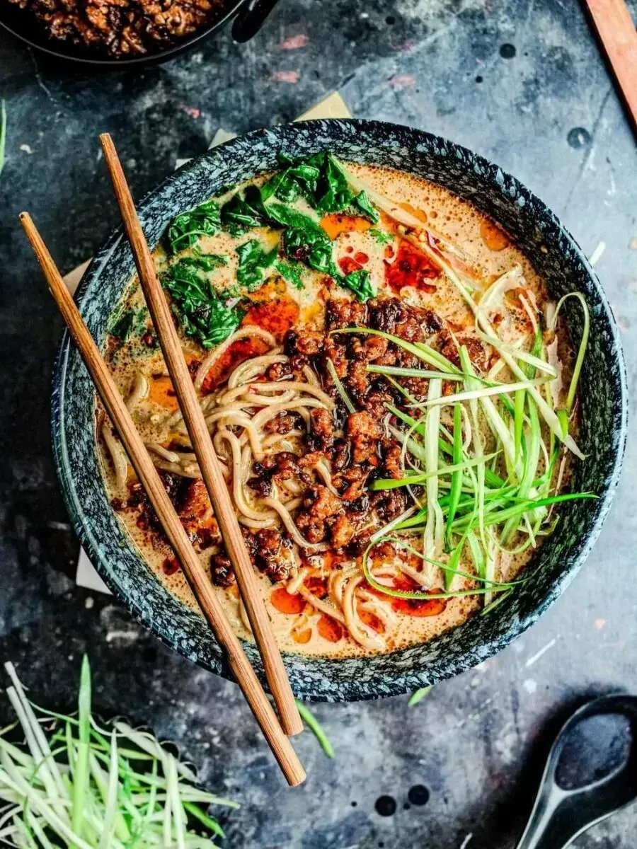 Bowl of vegan tantanmen ramen with chopsticks laying across the top.