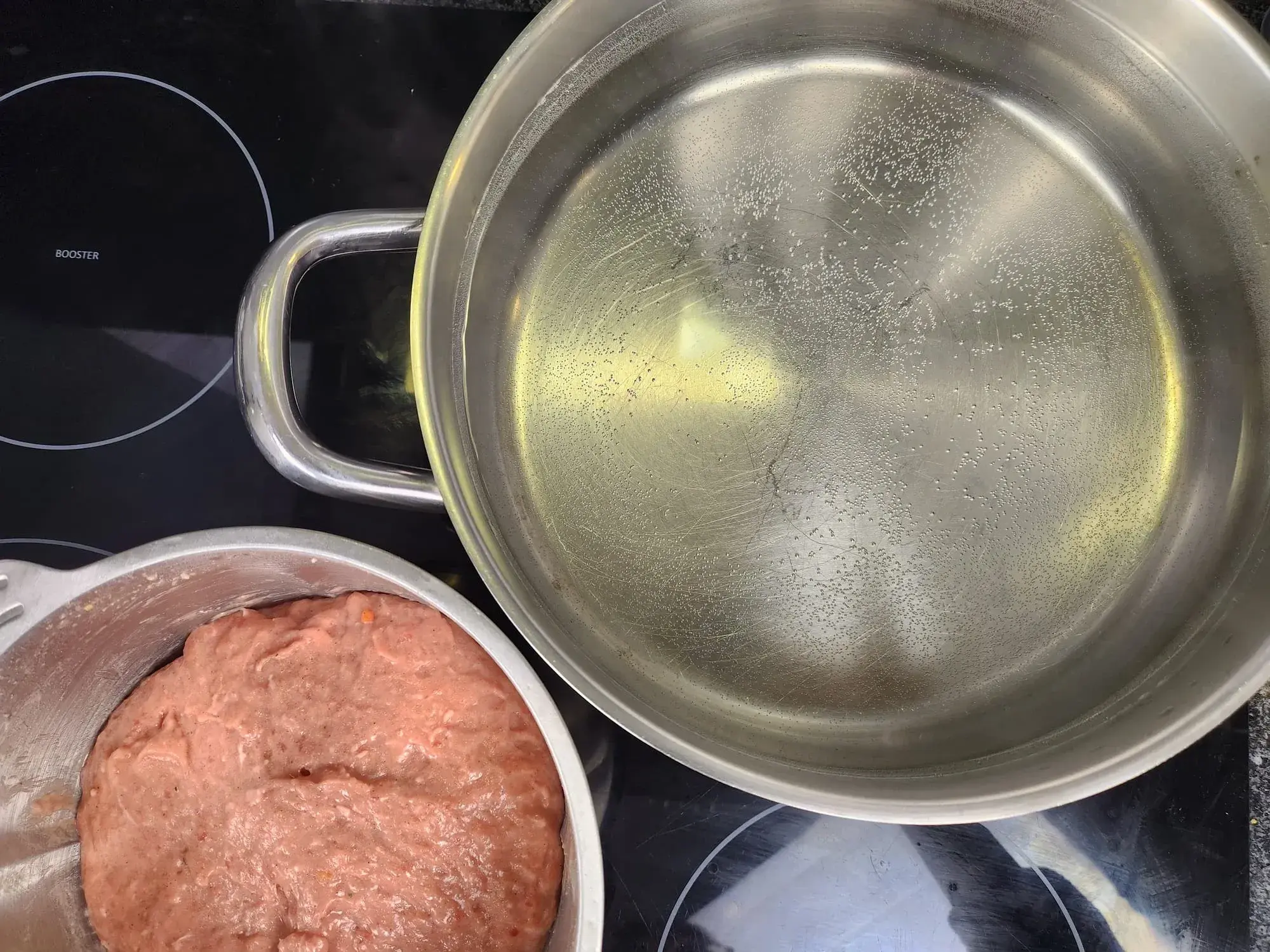 Cook the meatballs in water, but do not let the water boil as it may cause the meatballs to crack. Use low heat instead.