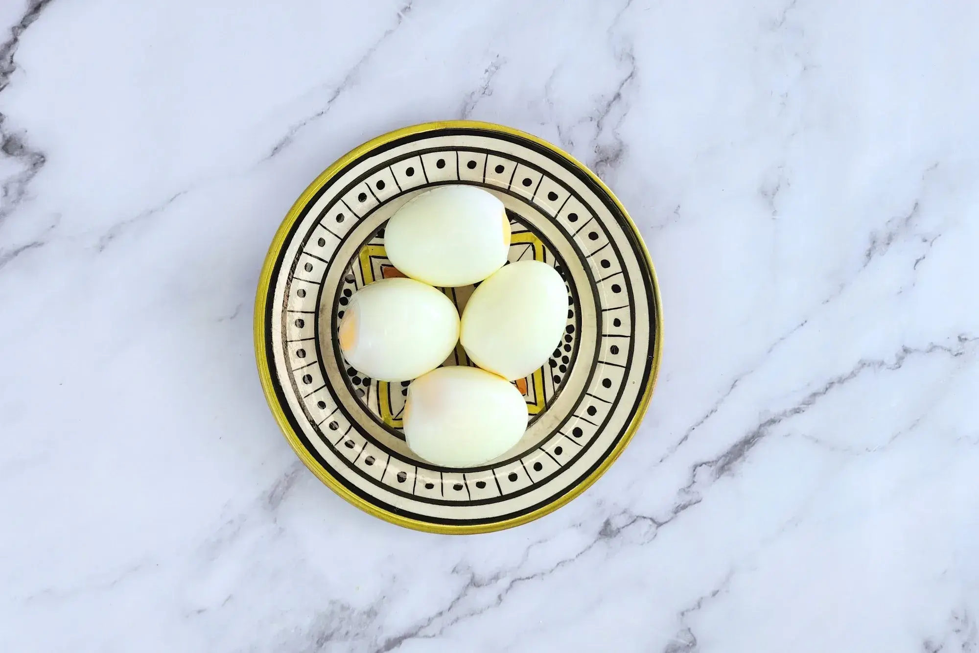 4 hard boiled eggs in a plate