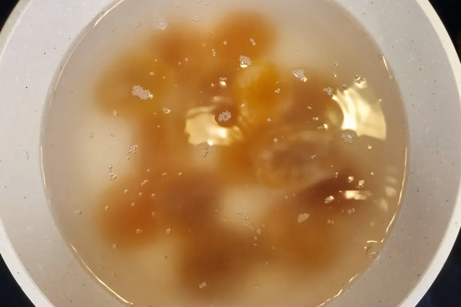 A boiling water with apricots.