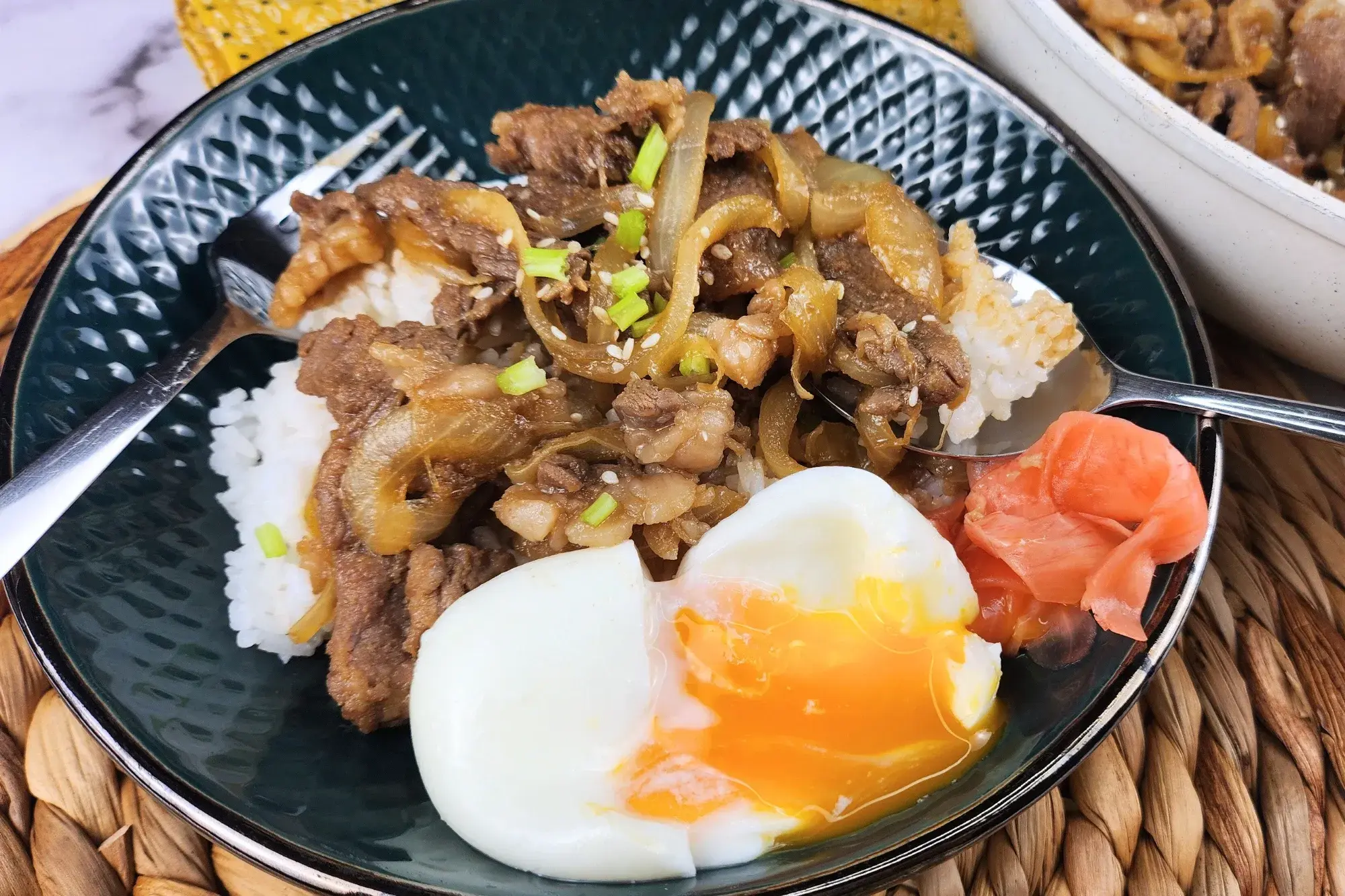 A bowl of apanese Beef and Onsen Egg (Gyudon). 