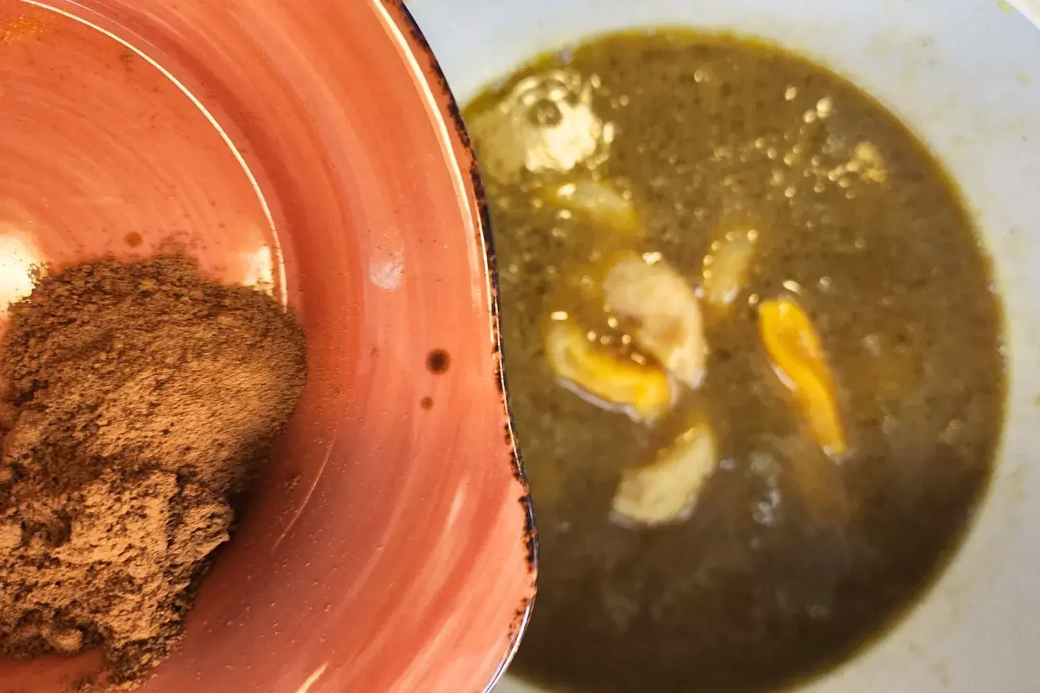 A bowl of cinnamon powder above a pot with broth.