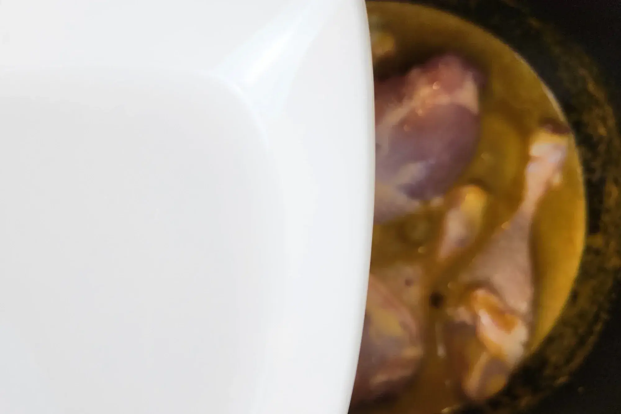 A bowl of water above the curry pot.