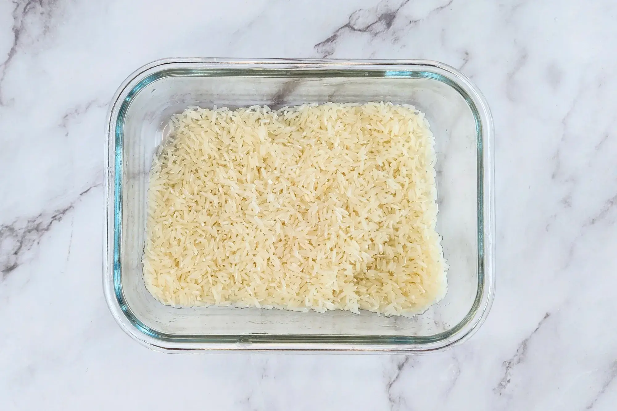 A container of washed jasmine rice