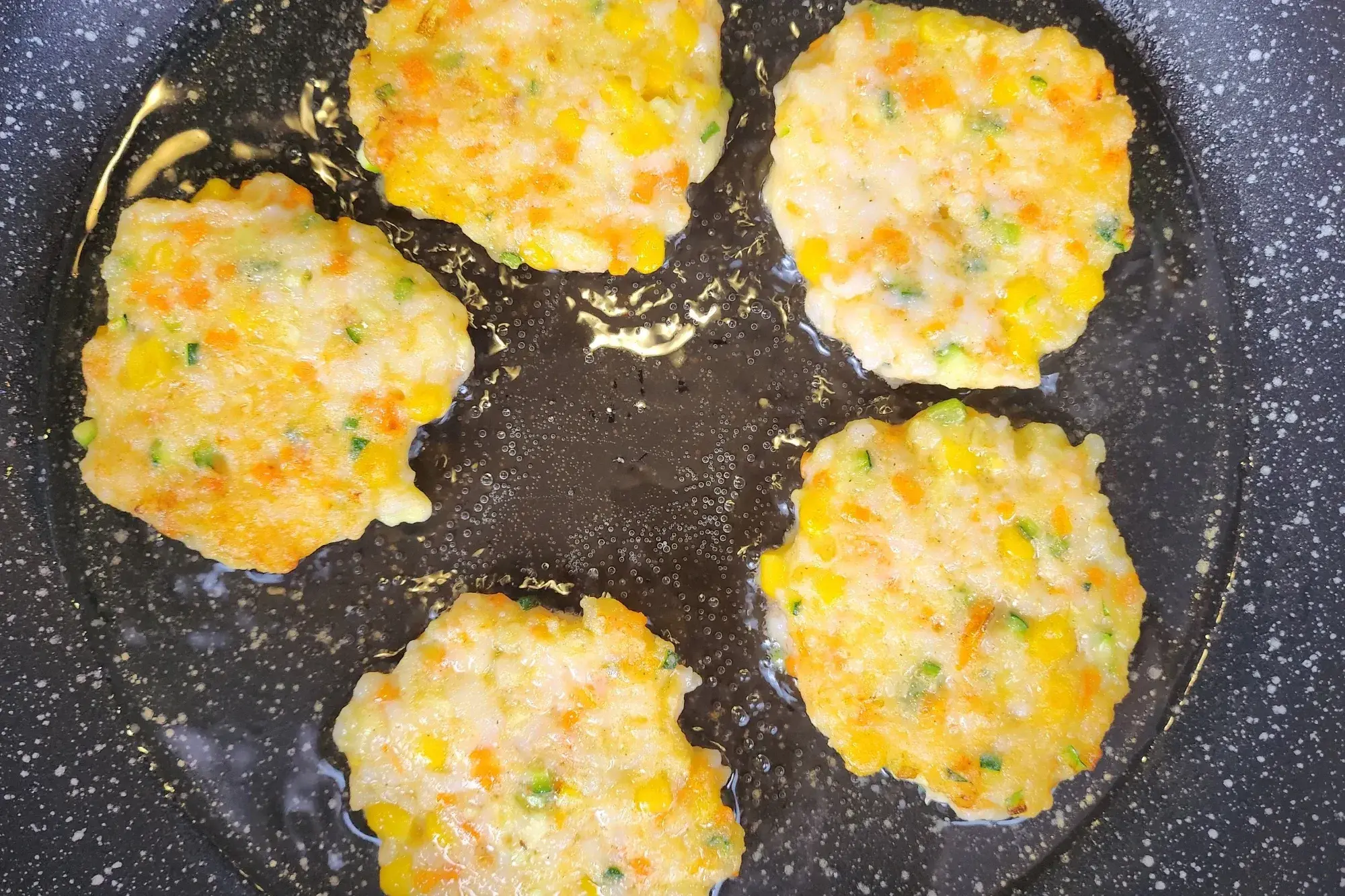 A frying pan of Shrimp Fritters