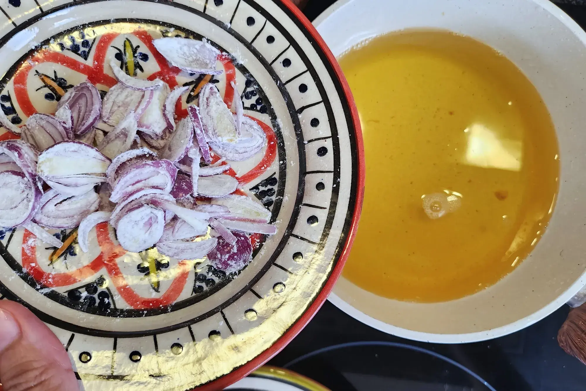 A plate of sliced shallot above frying pot
