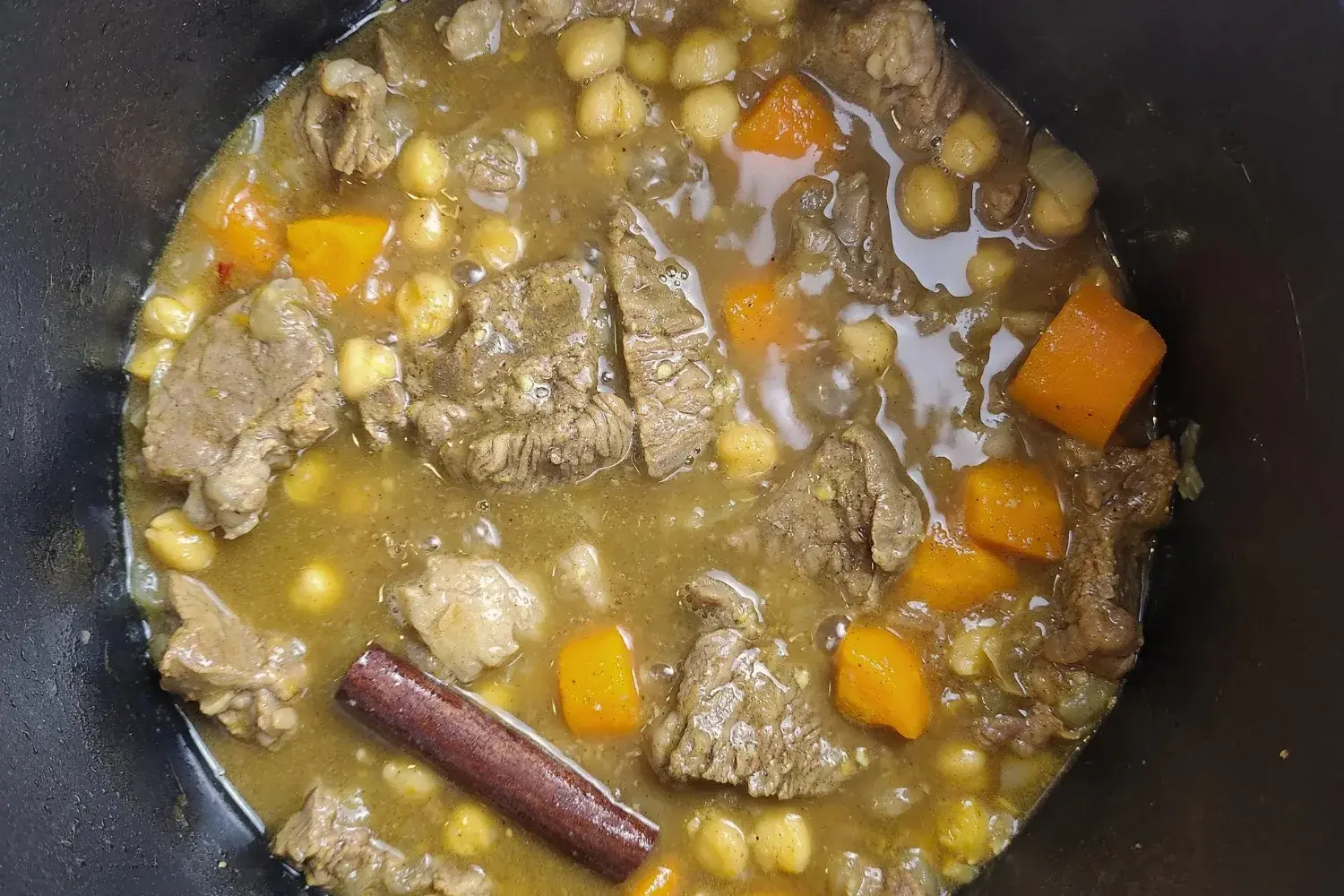 A pot of cooked meat.