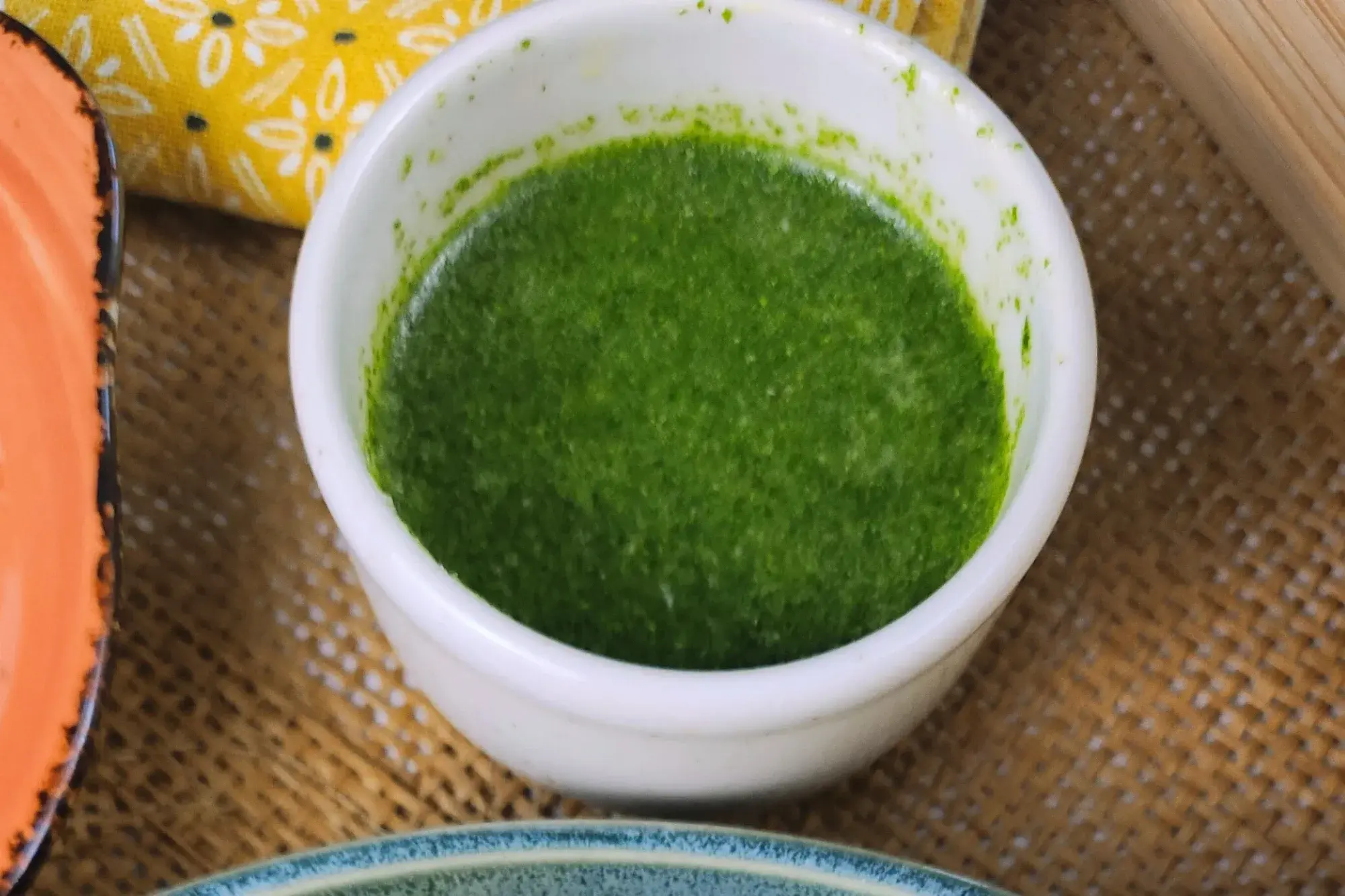 A small bowl of green sauce.