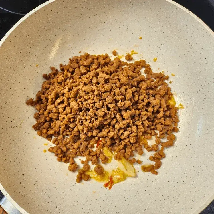 Beyond Mince added to the pan