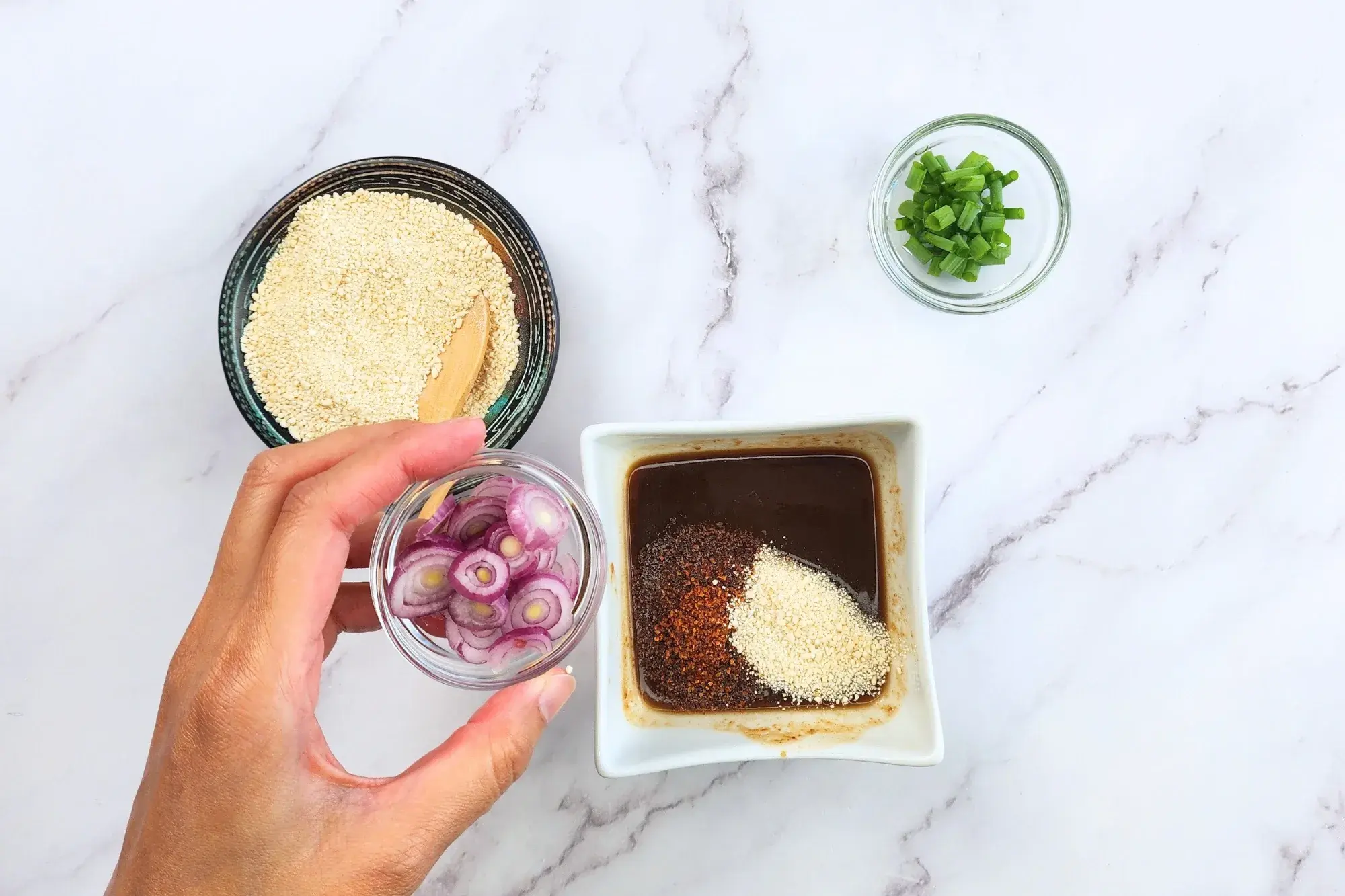 Add chili flakes, toasted rice powder, shallots
