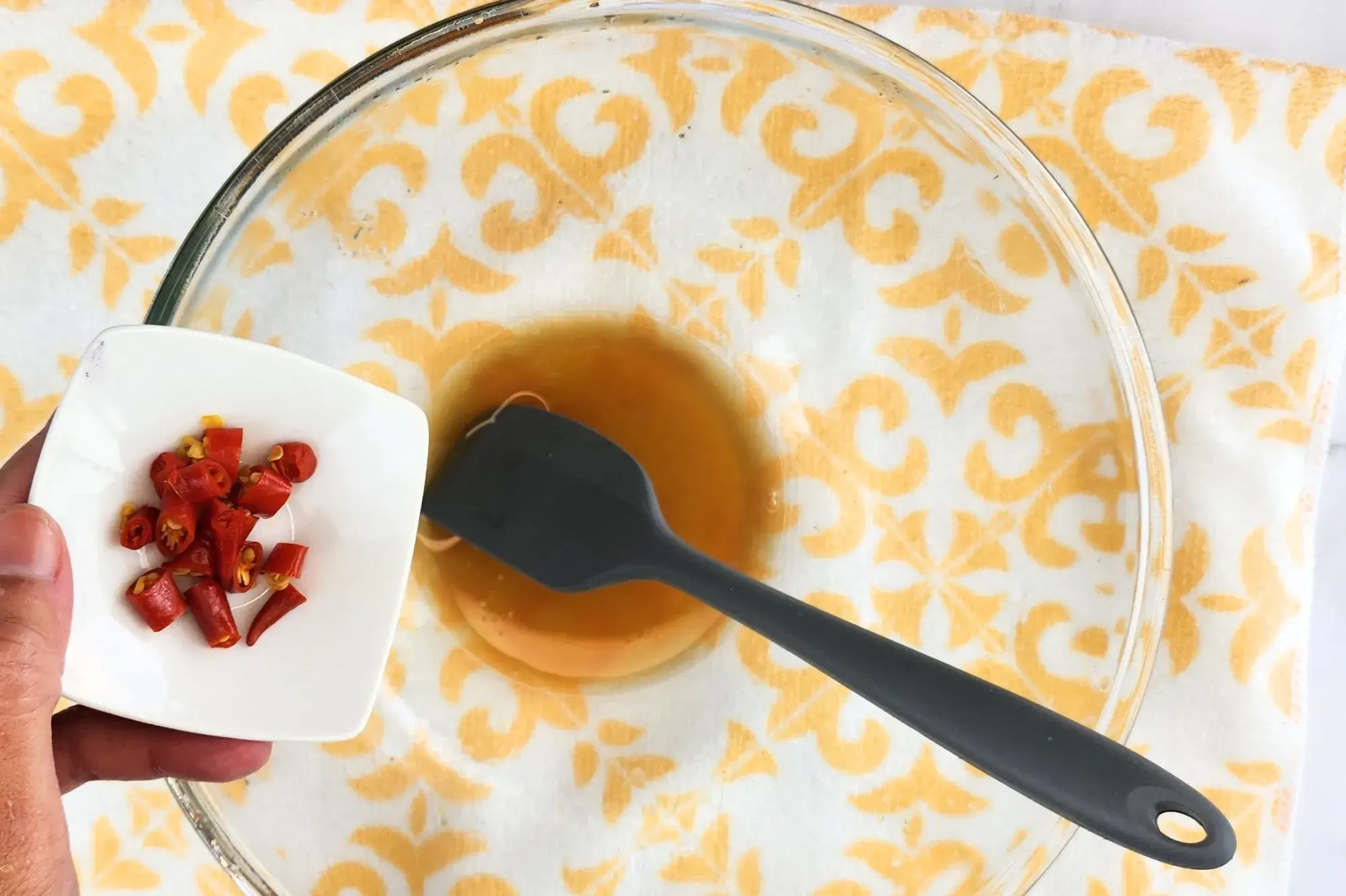 Add chilies into the dressing. 