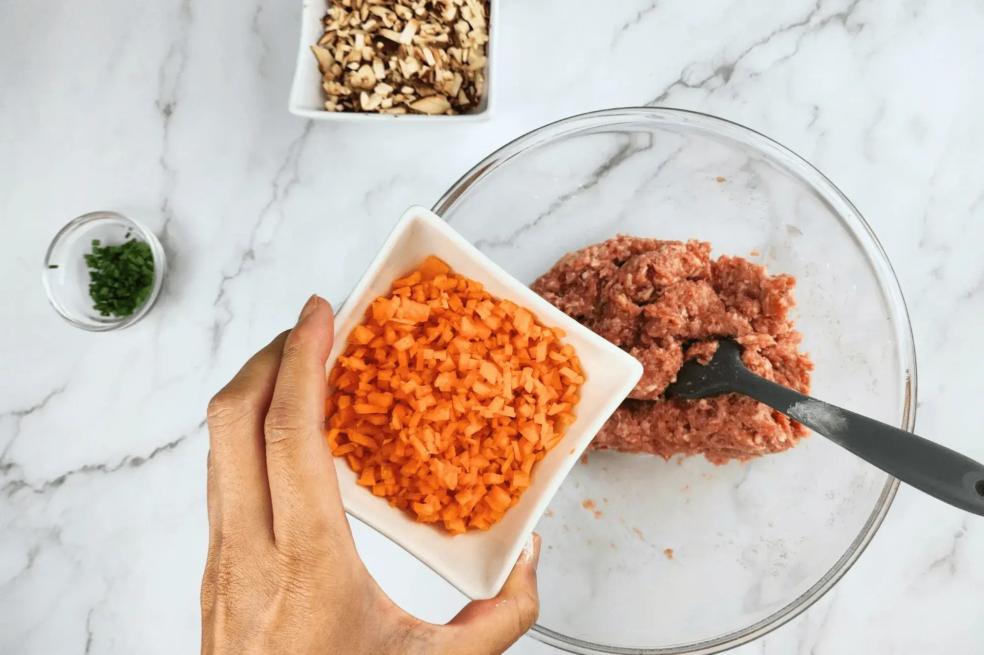 Finely diced carrots with mixing bowl