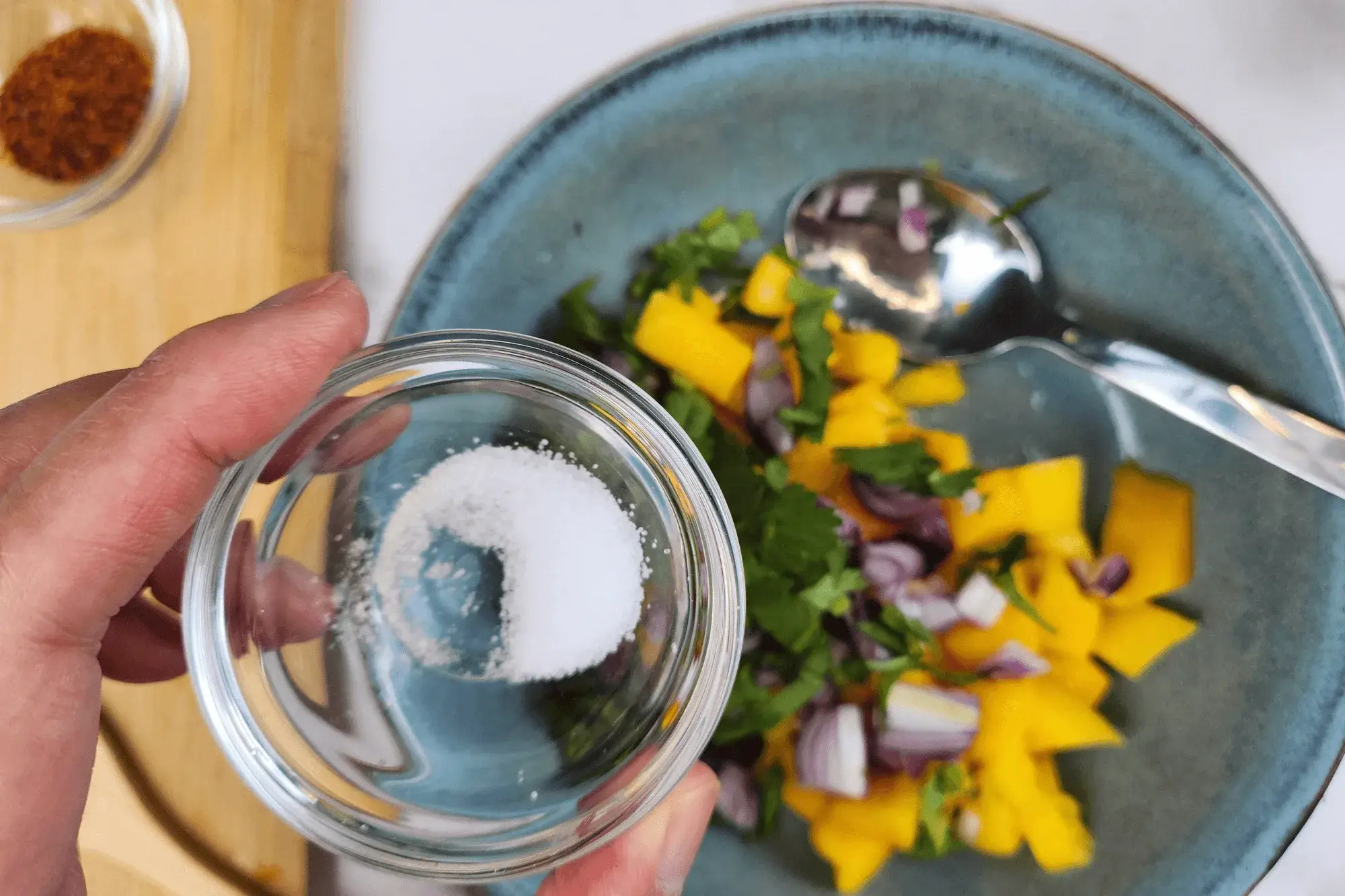 Add salt into mango salad