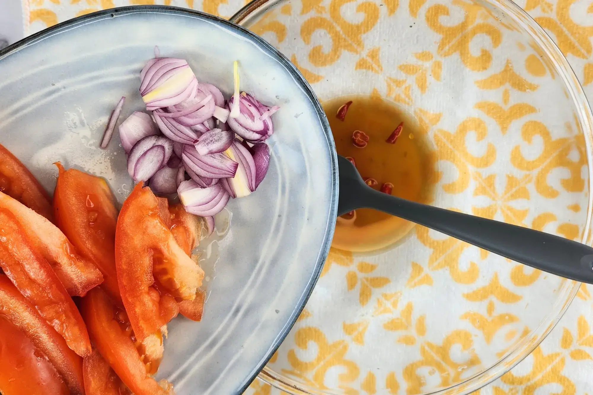 Add shallots and tomato into the dressing. 