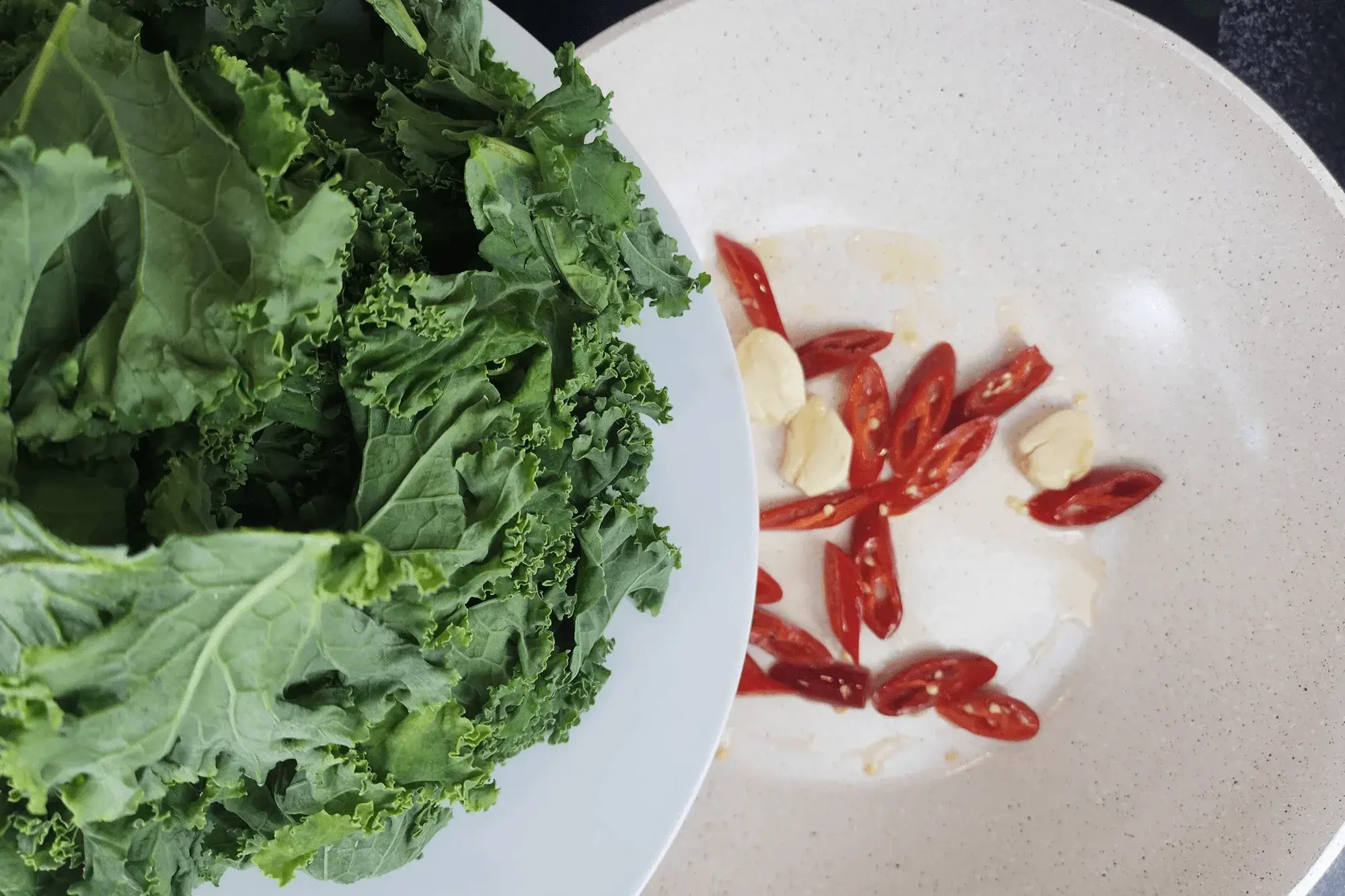 Add the kale into a wok