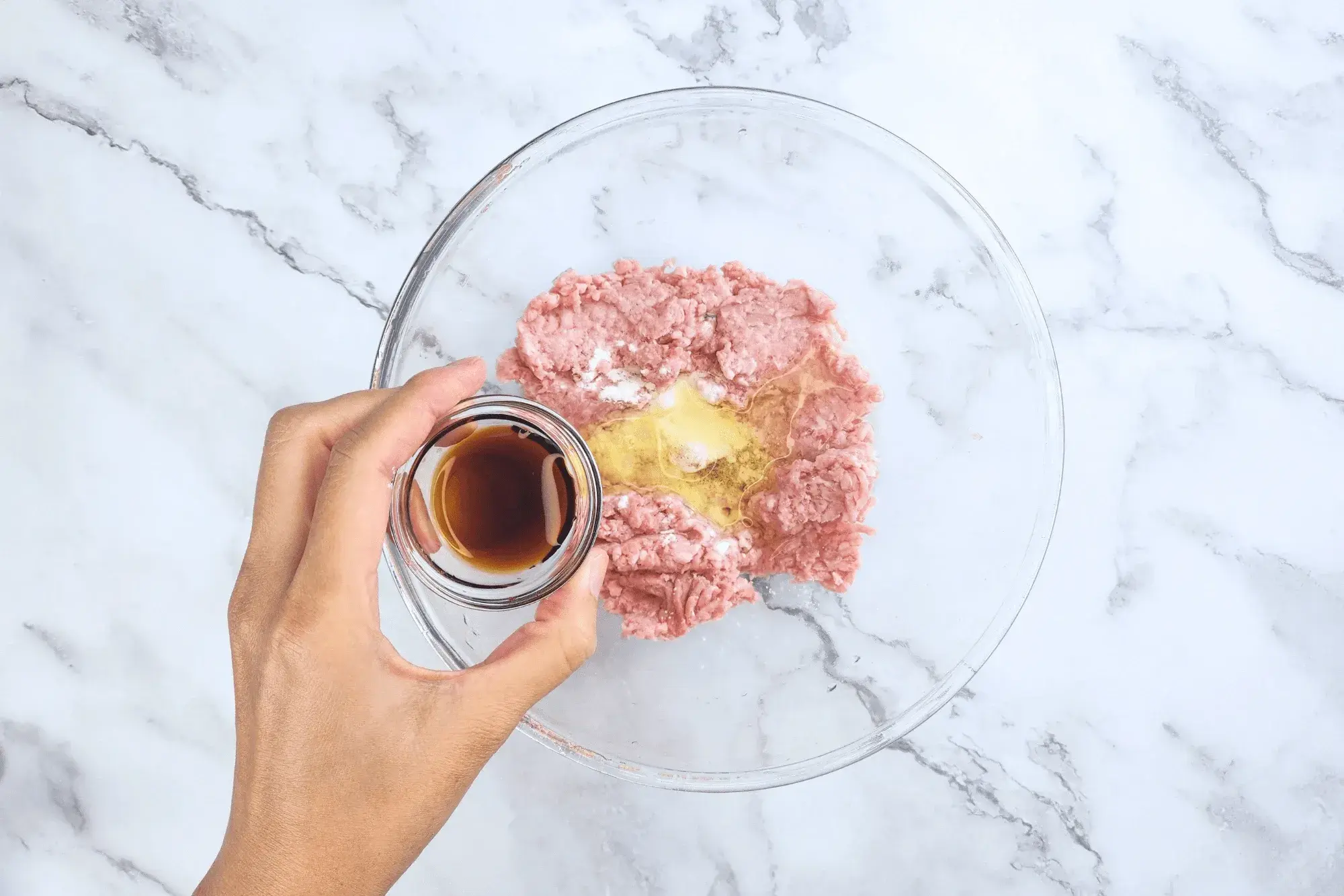 Add this mixture to the mixed ground pork along with egg white and soy sauce.