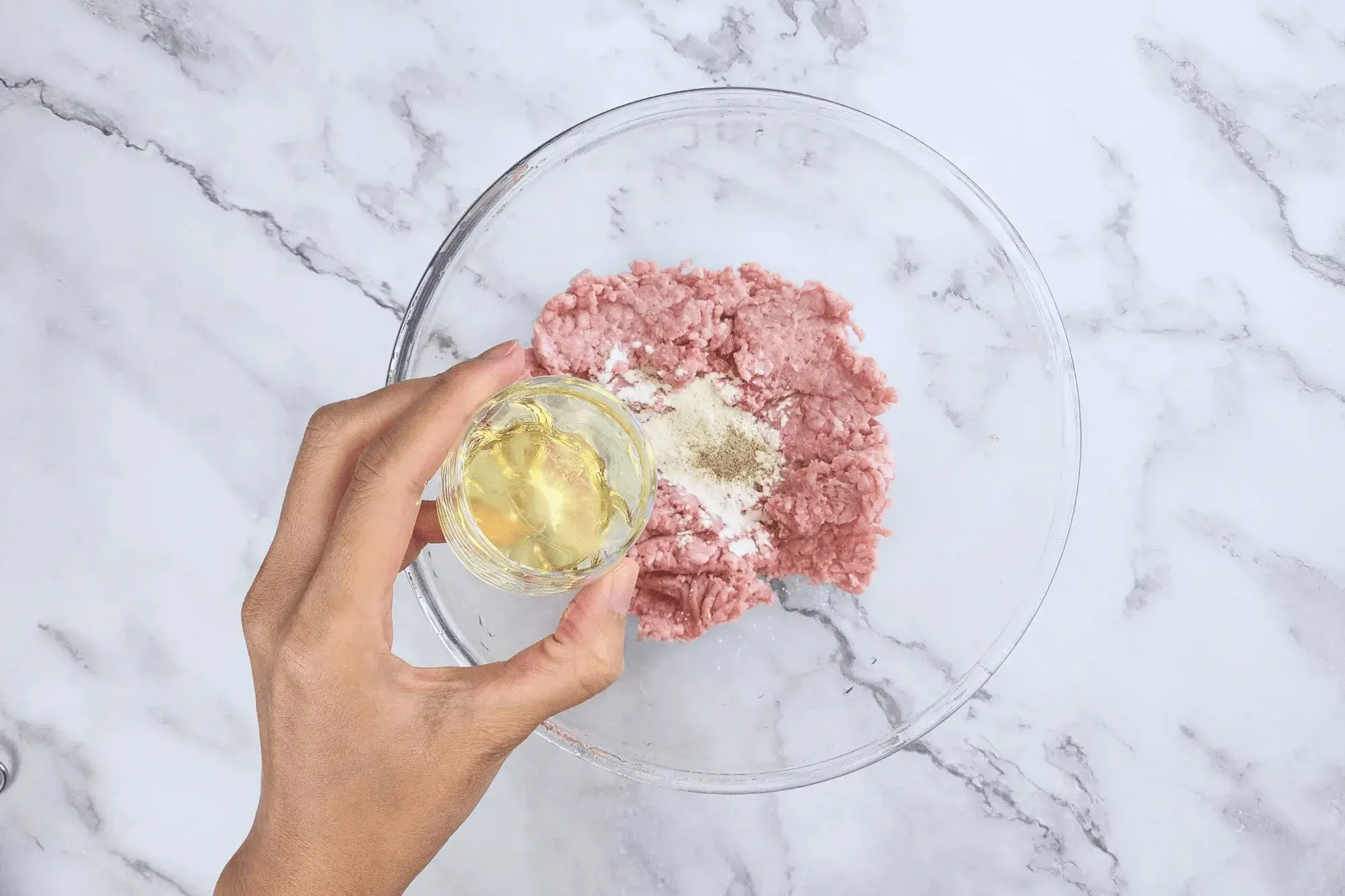 Add this mixture to the mixed ground pork along with egg white 