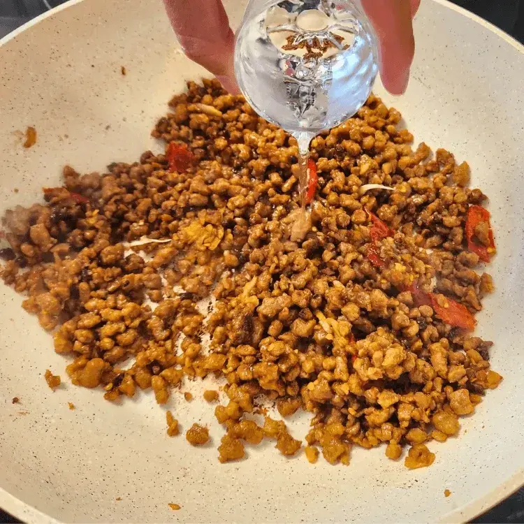 Adding water into the pan