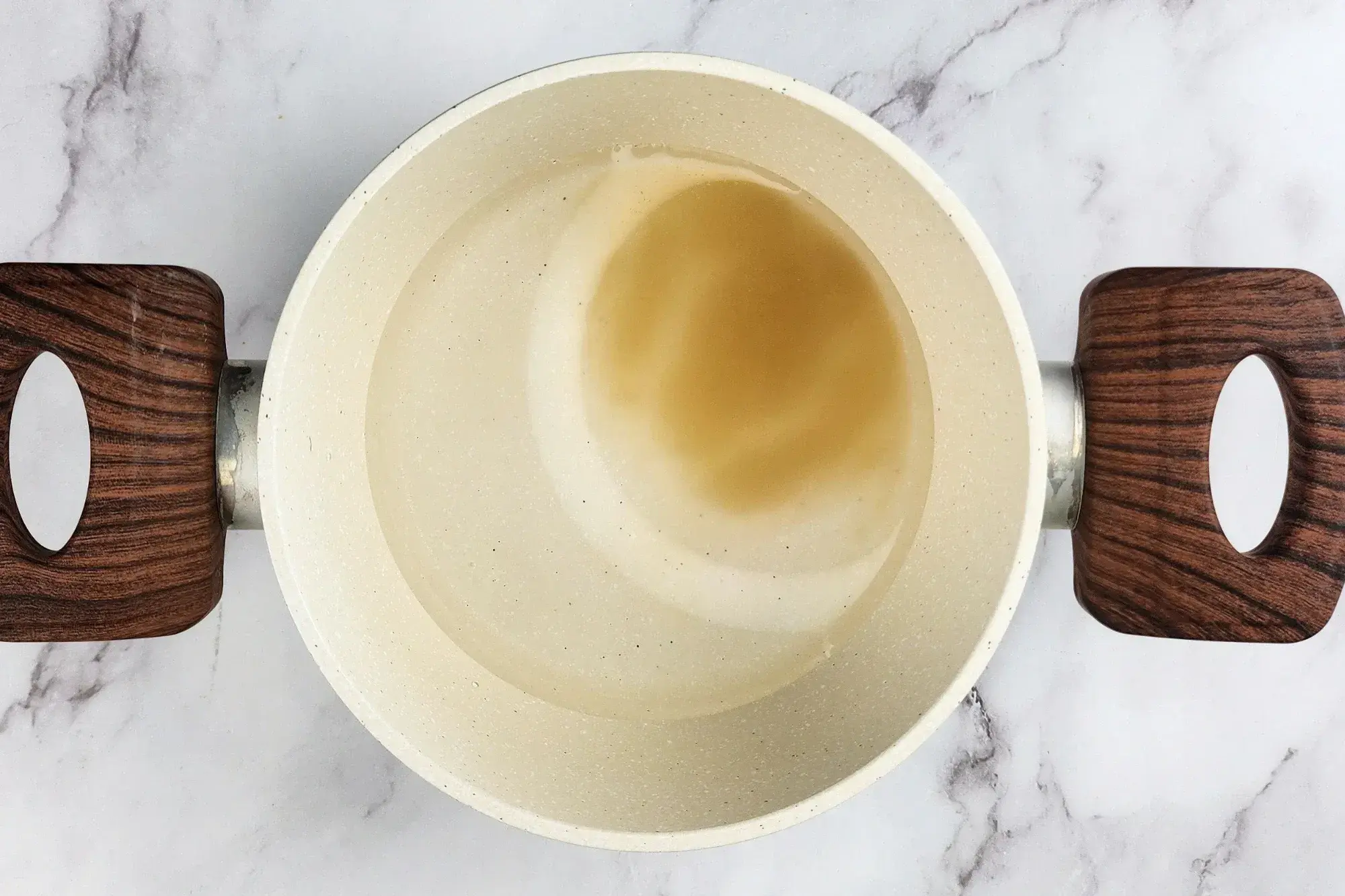 Agar powder in a pot of water