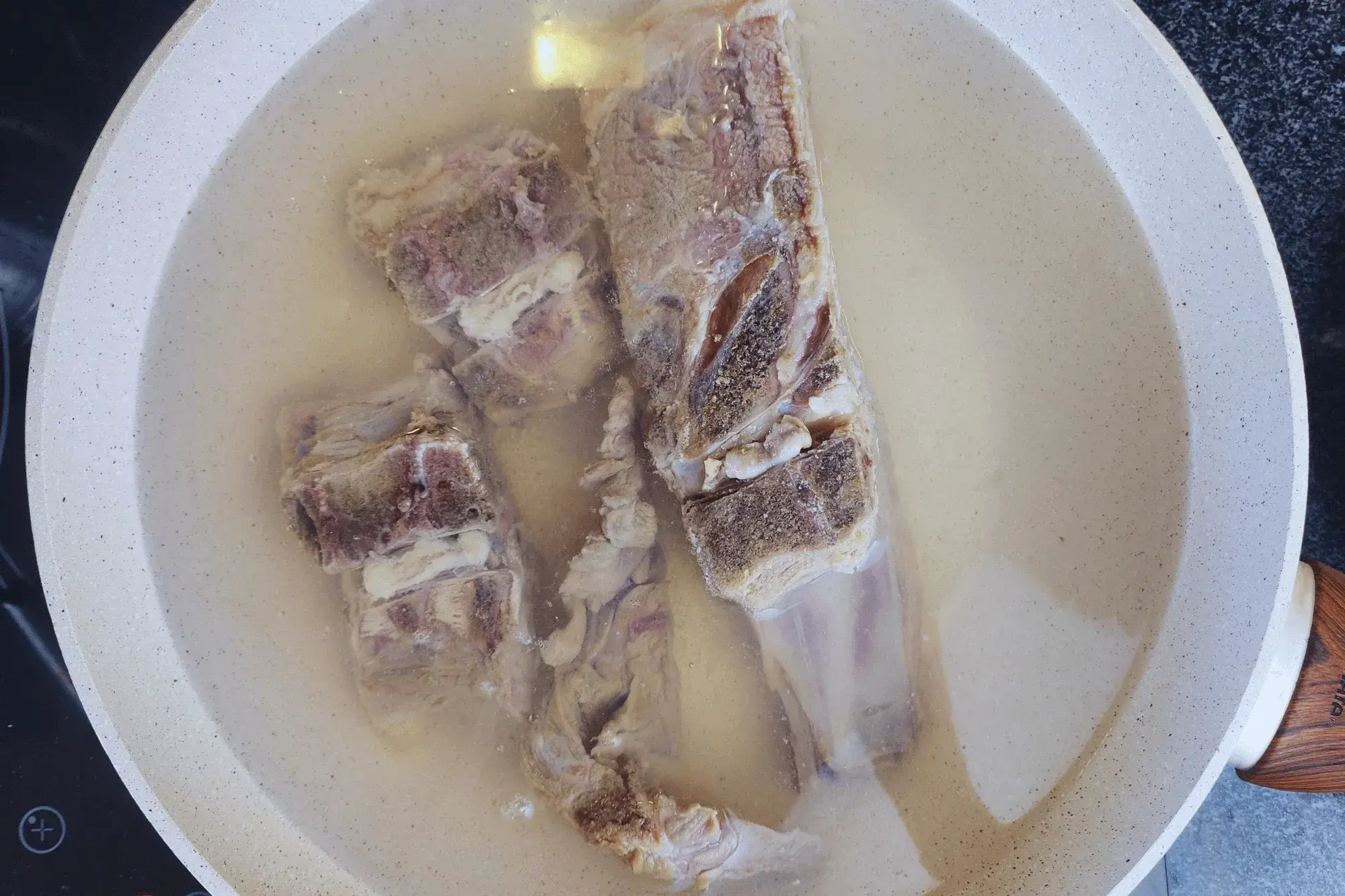 pork bones in boiling water