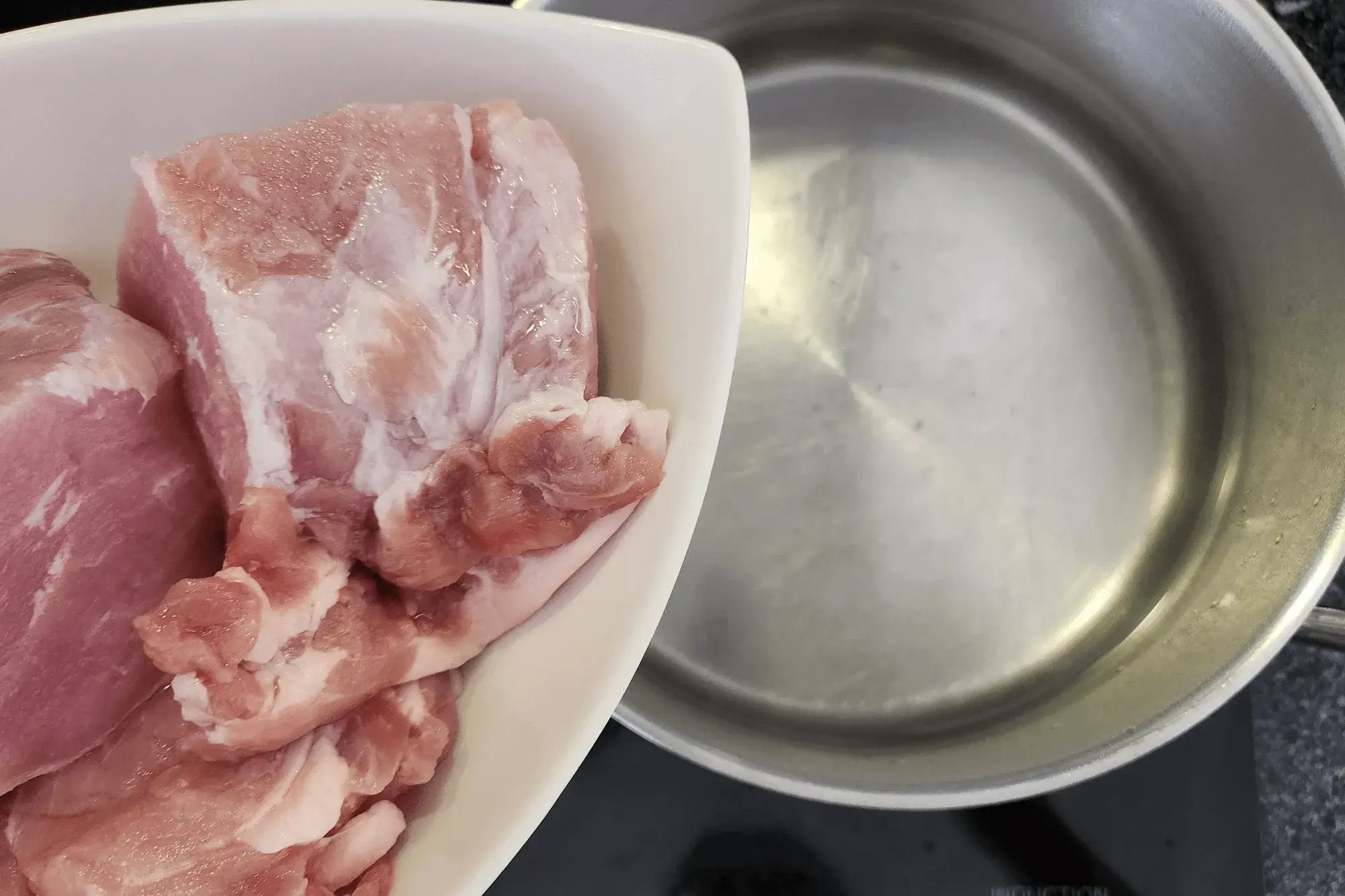Bring a pot of water to a boil and add the pork.
