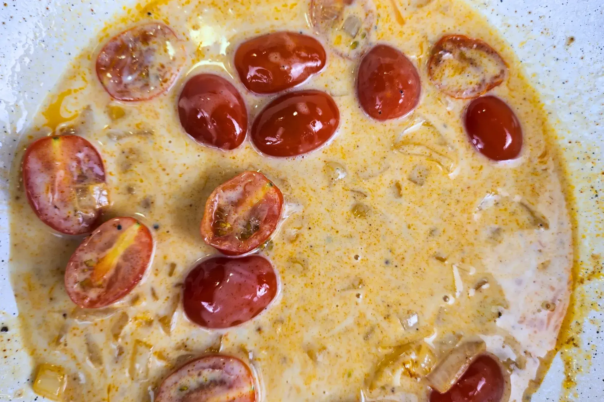 Cherry tomatoes cooked in cream sauce