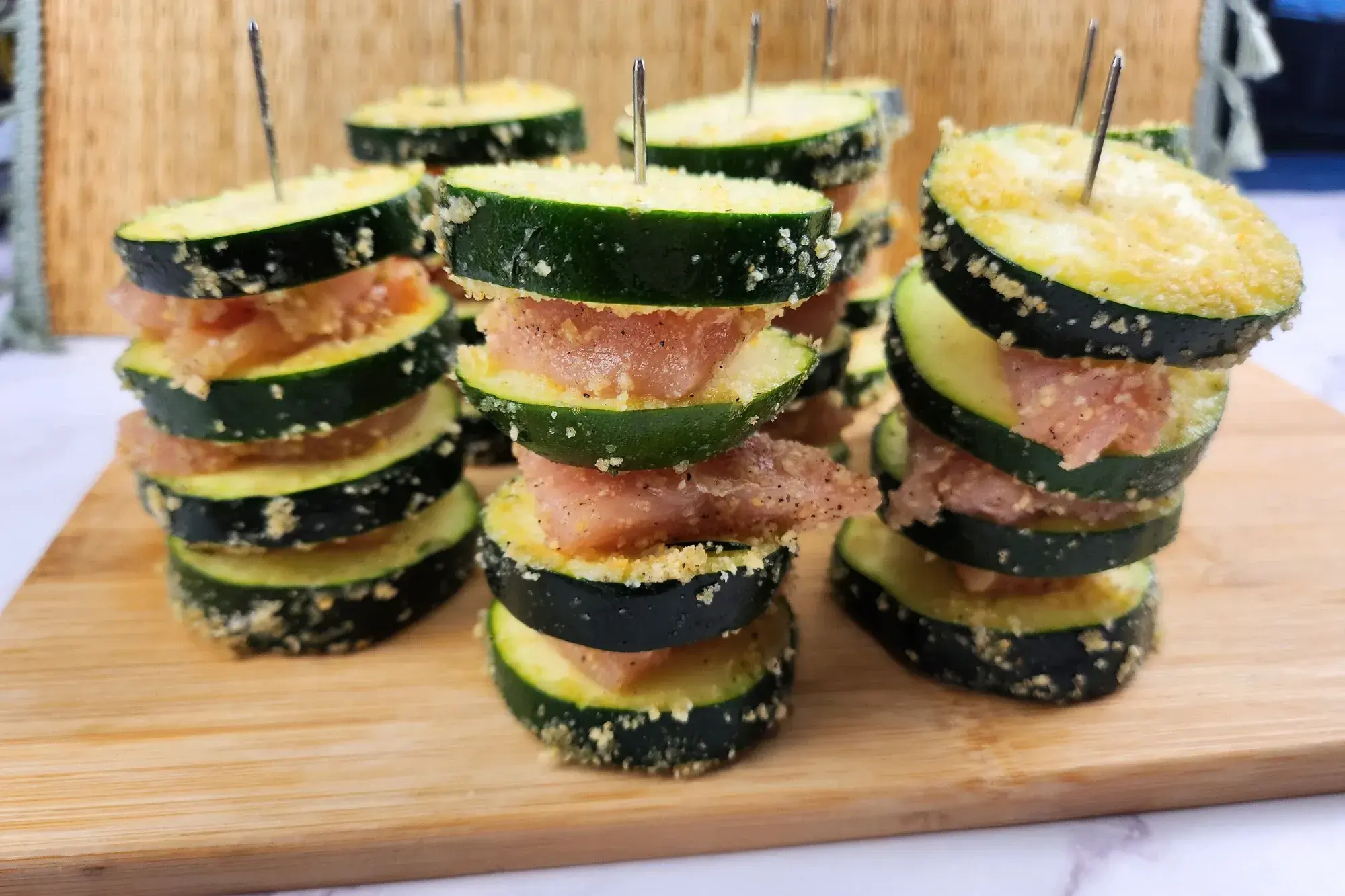 Chicken and Zucchini Skewers on a wooden board.