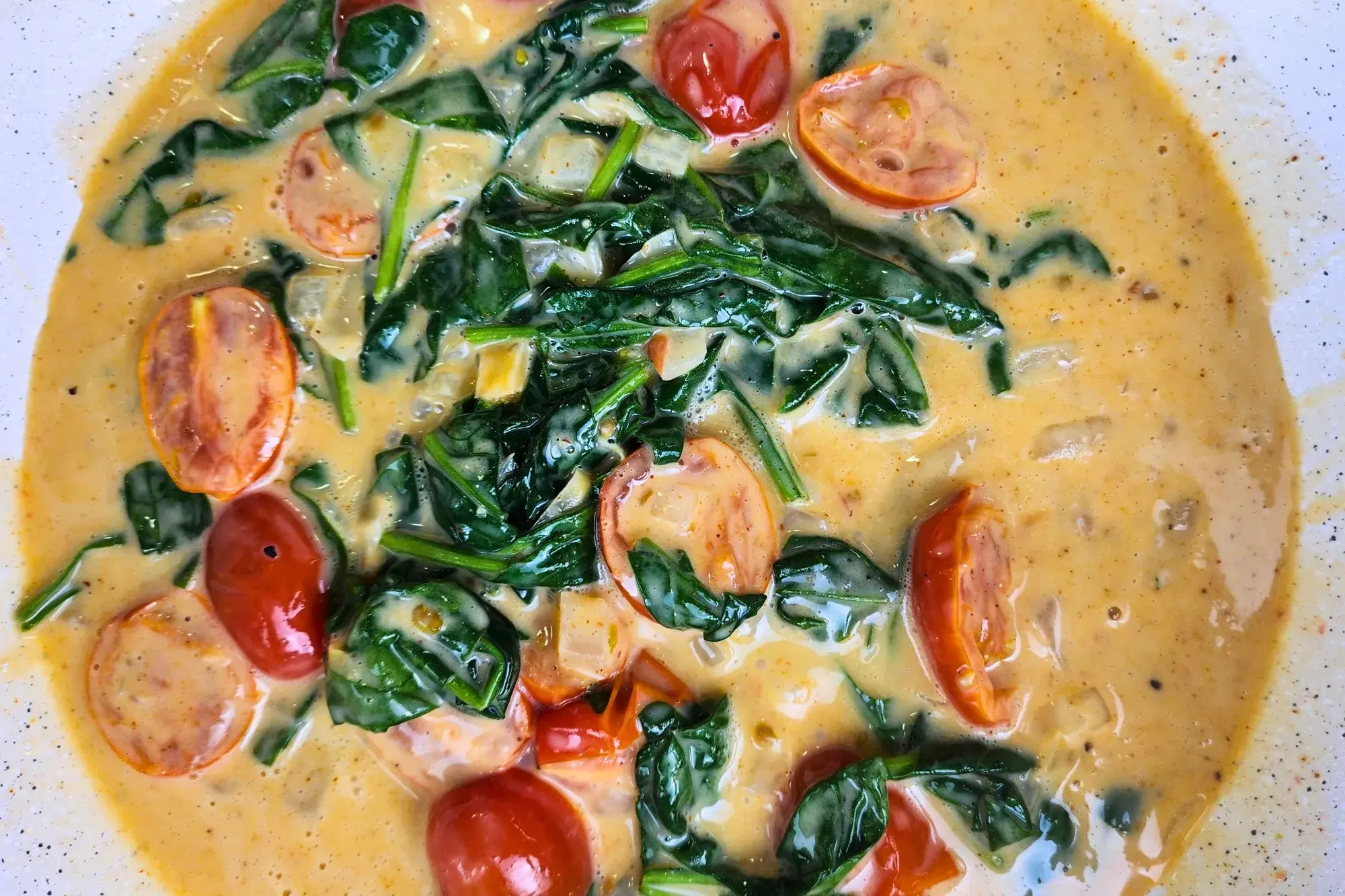 Cherry tomatoes cooked in cream sauce