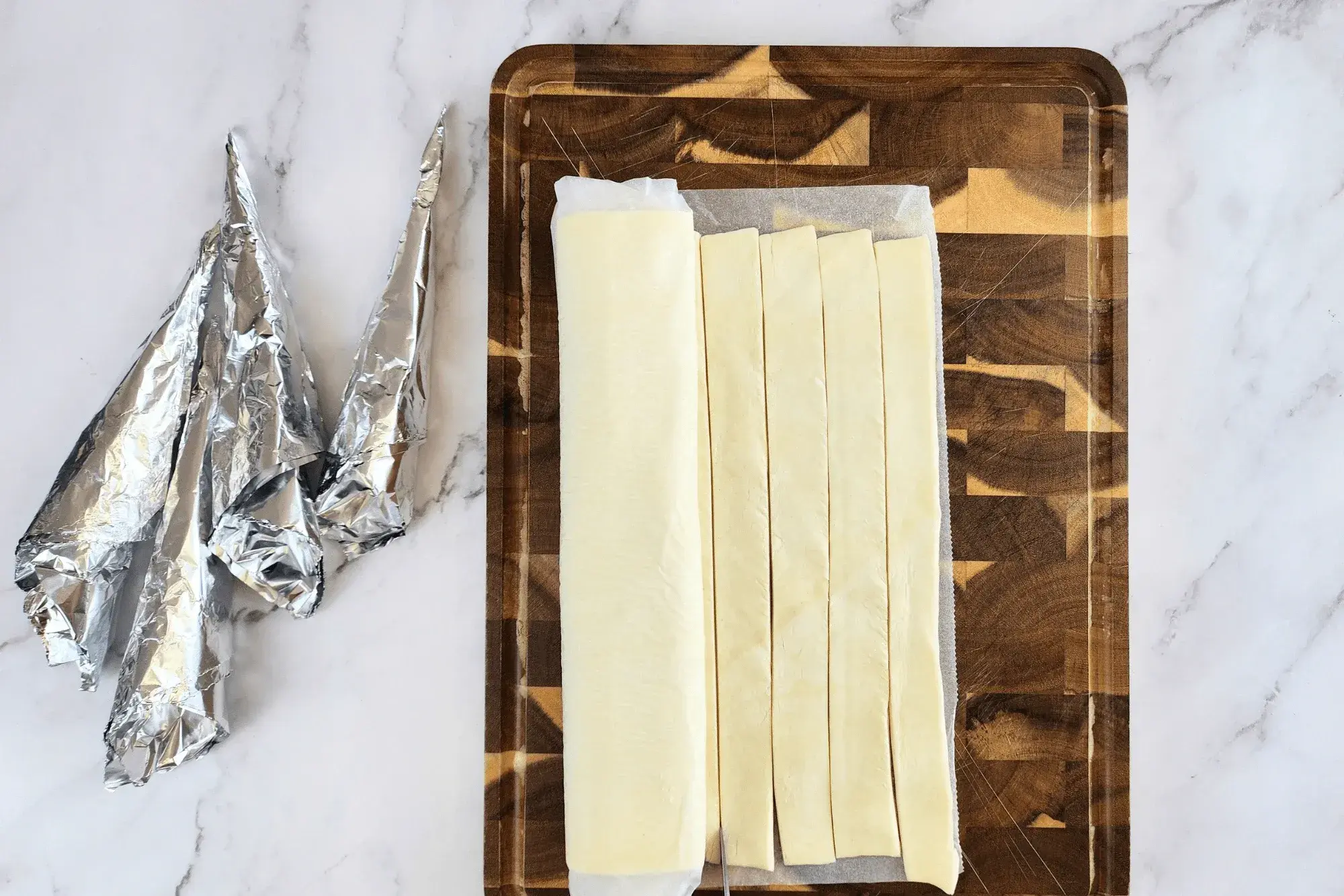 Cut puff pastry into 1-inch strips