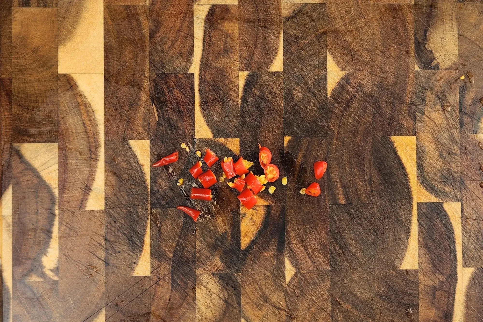  finely chopping the bird’s eye chilies