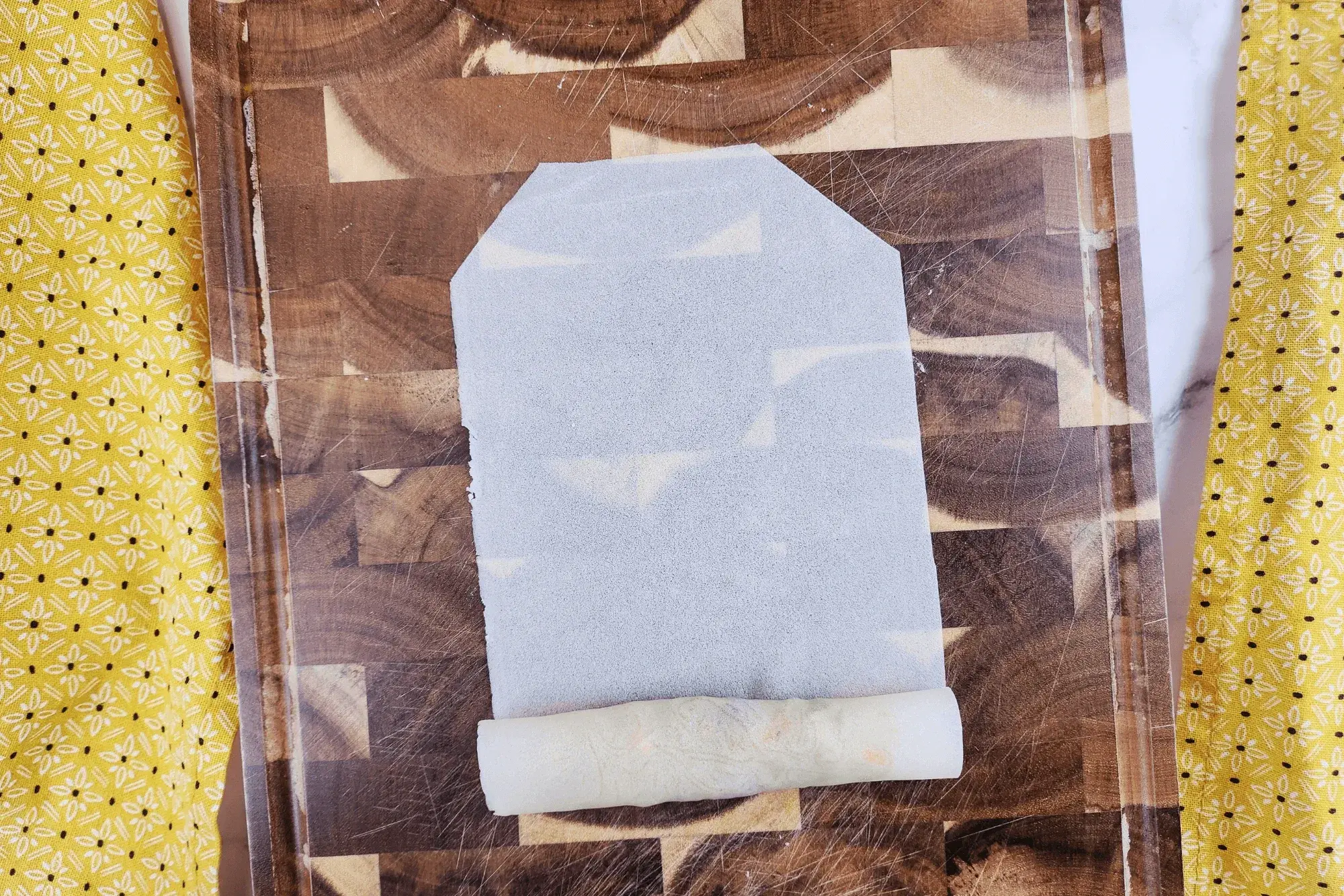 Fold it up by holding the top slightly tight 