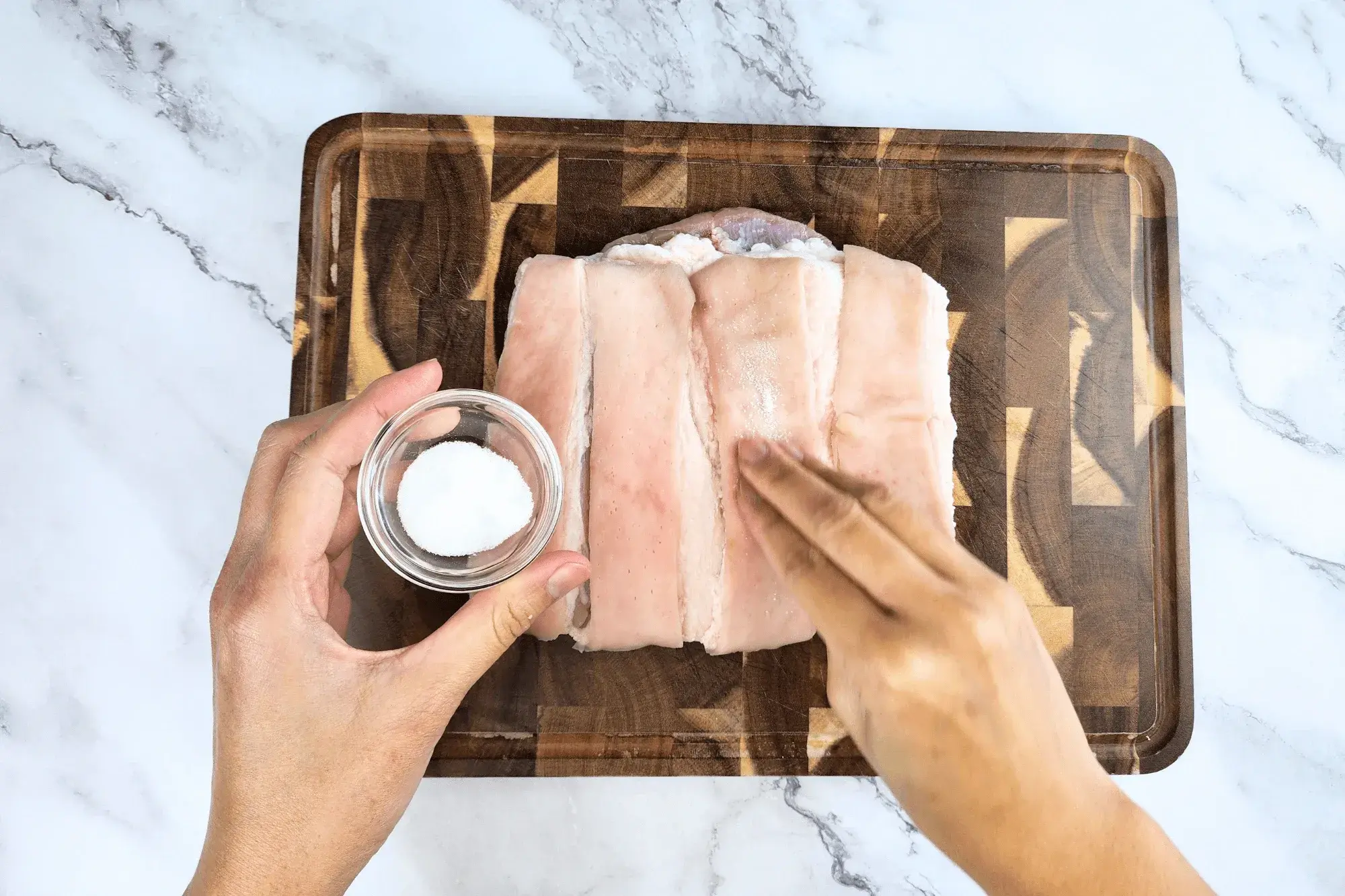 Generously rub salt all over the skin.