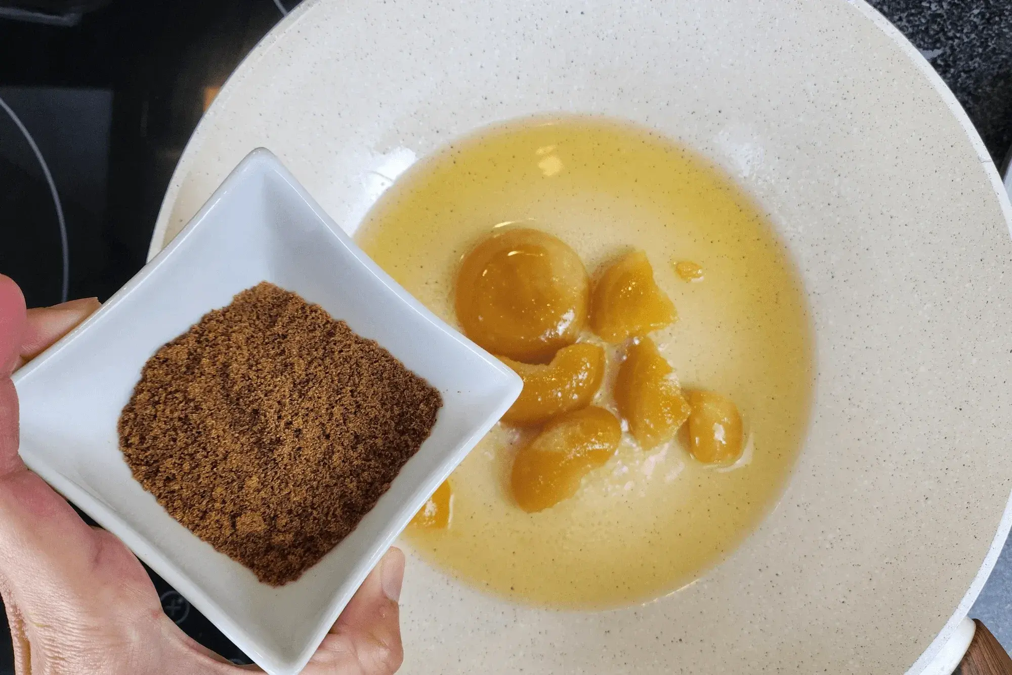 Heat a pan over medium heat. Add water, palm sugar, and brown sugar,