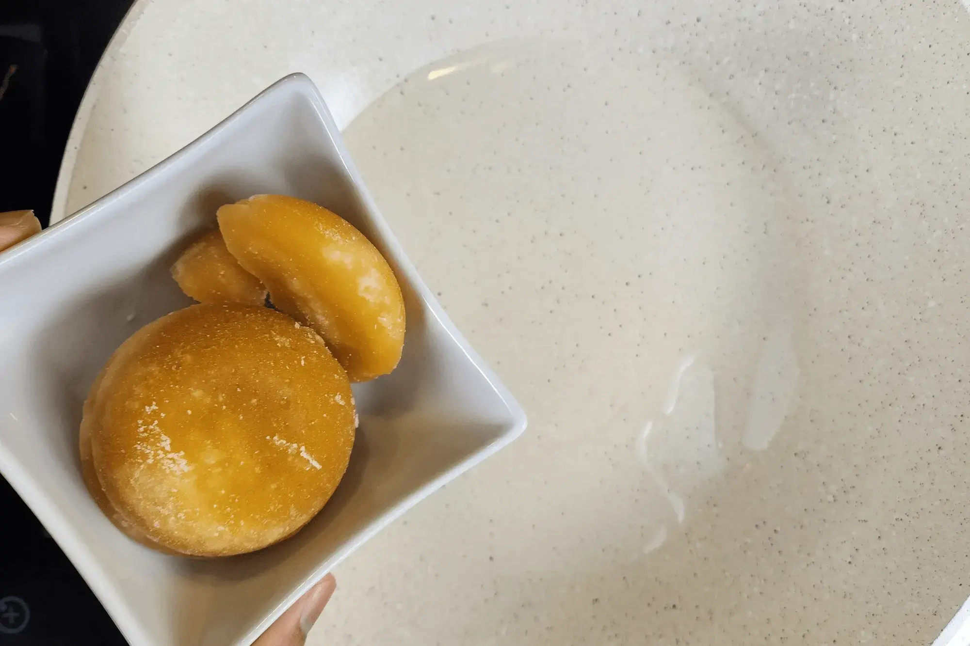 Heat a pan over medium heat. Add water, palm sugar