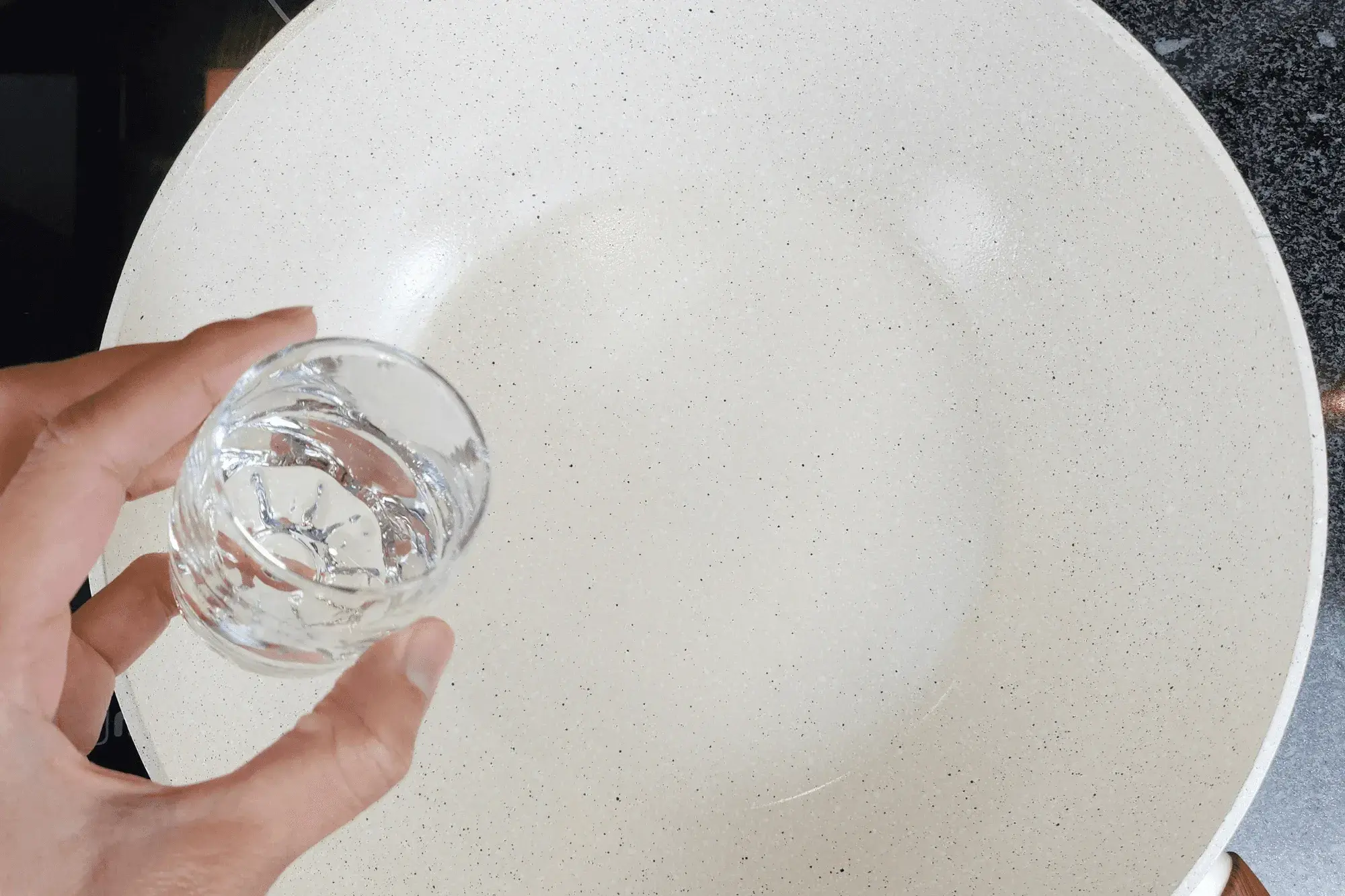 Heat a pan over medium heat. Add water