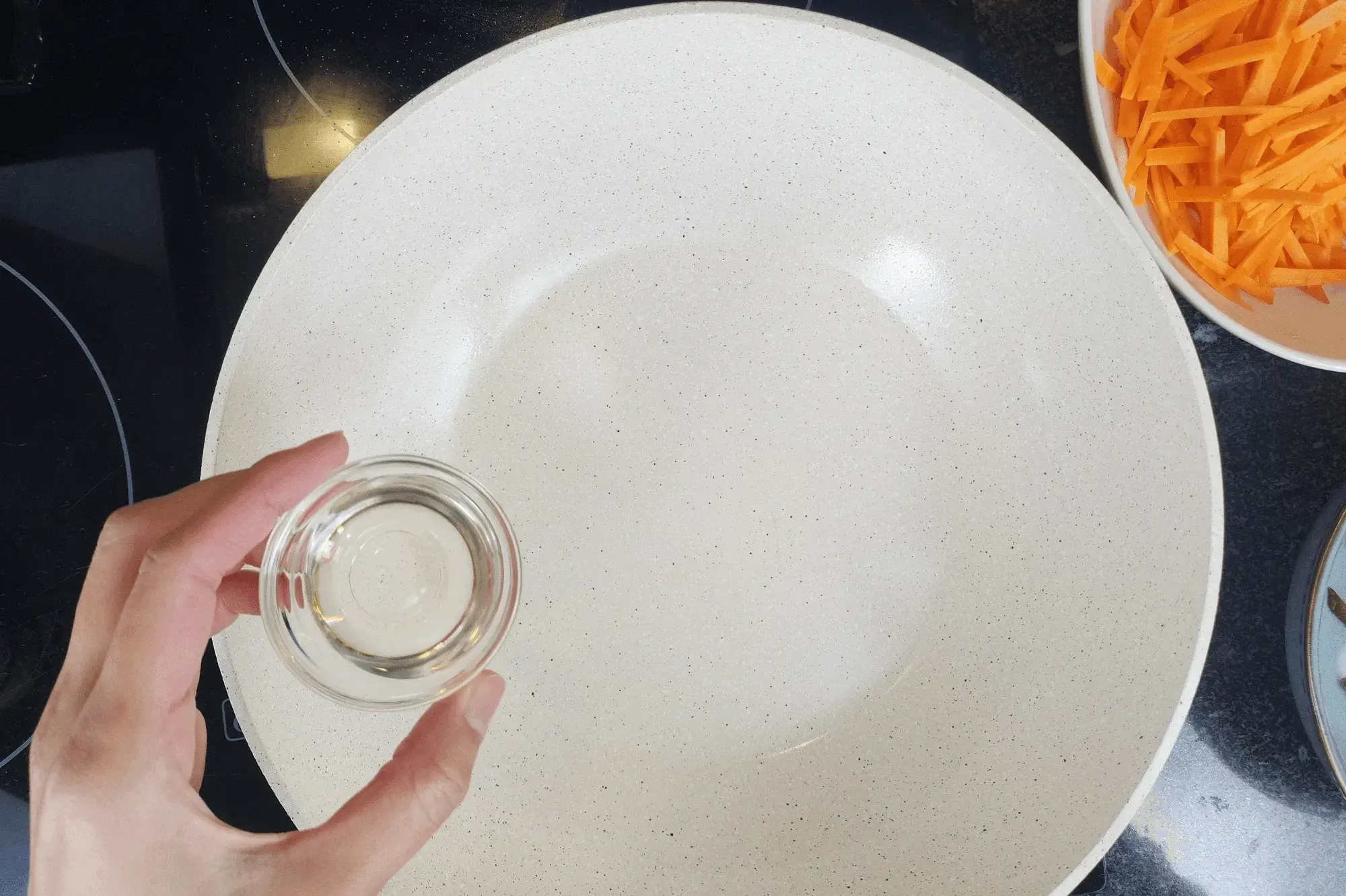 Heat vegetable oil in a pan over medium heat.