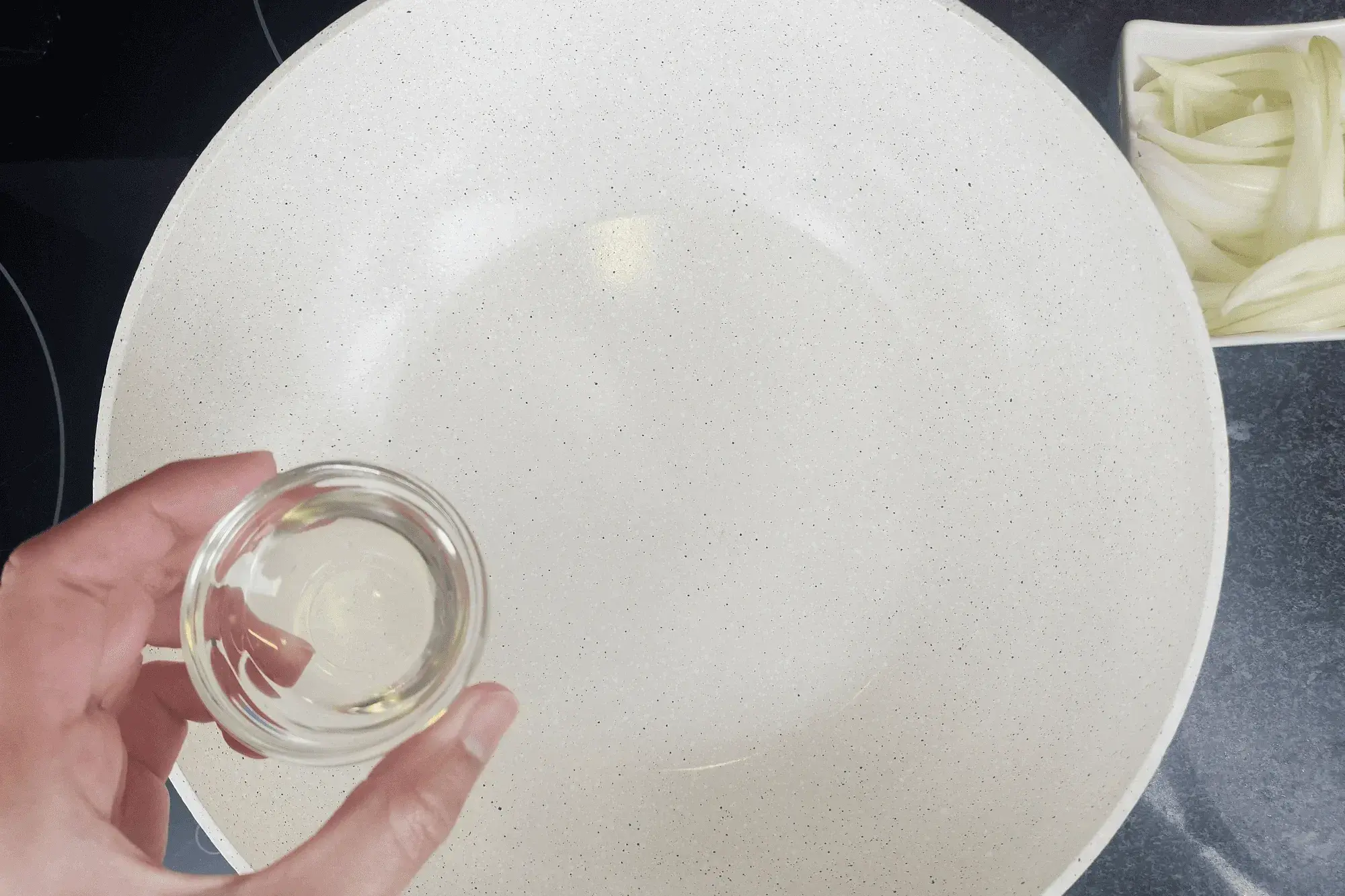 Heat vegetable oil in a pan over medium heat.