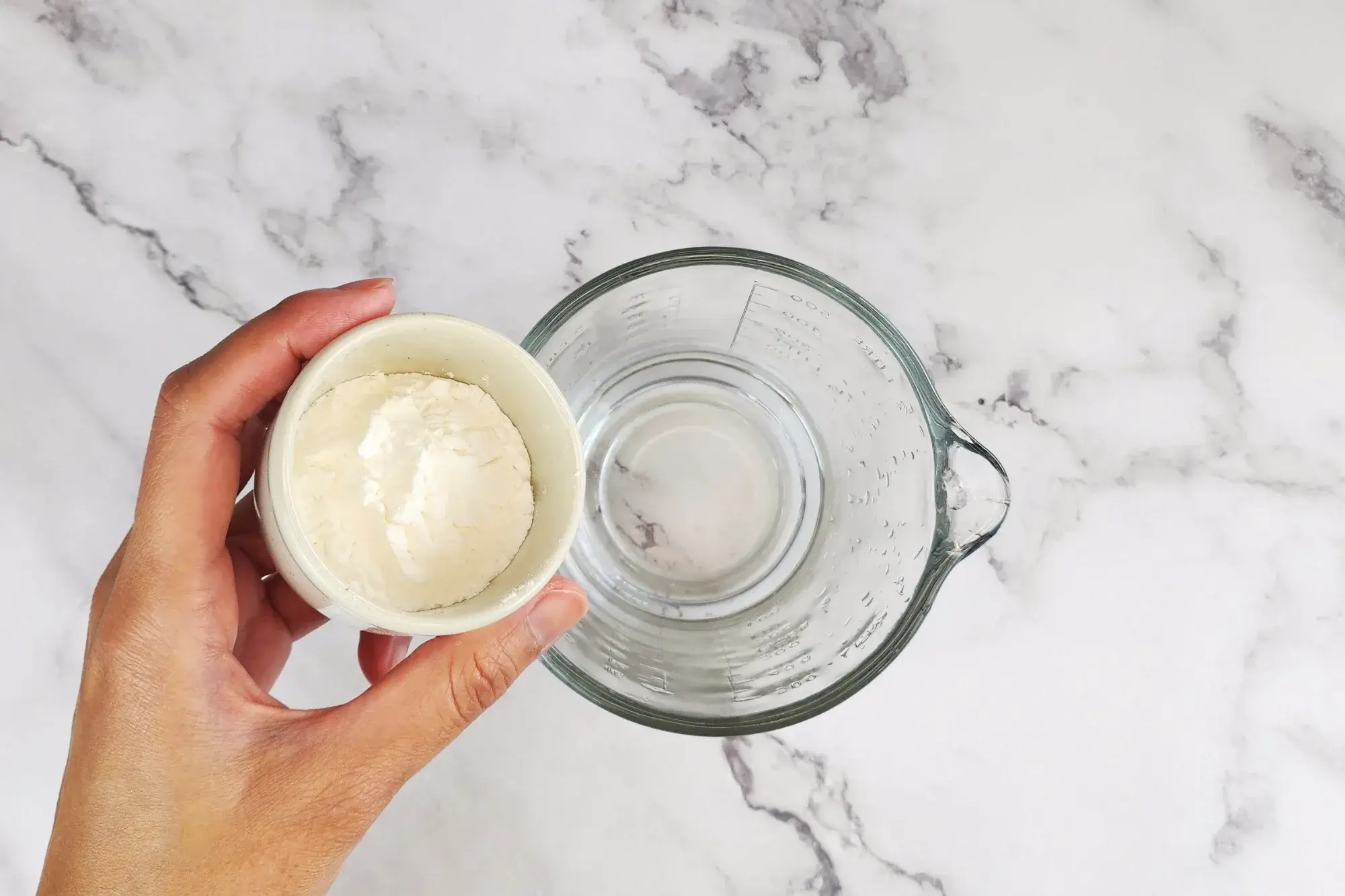 In a cup, combine water with arrowroot flour 