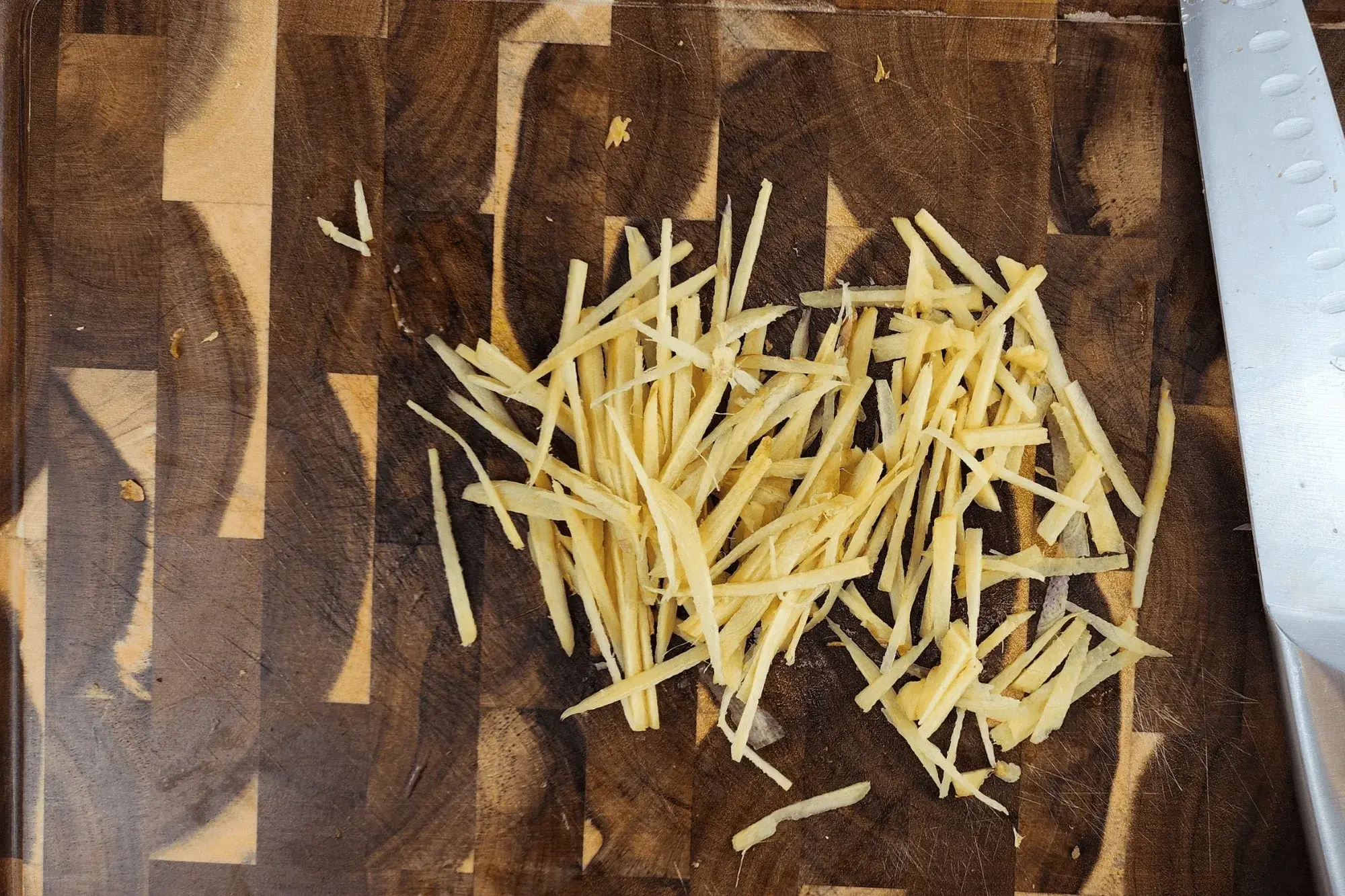 Julienne the ginger into thin, 2-inch-long strips.