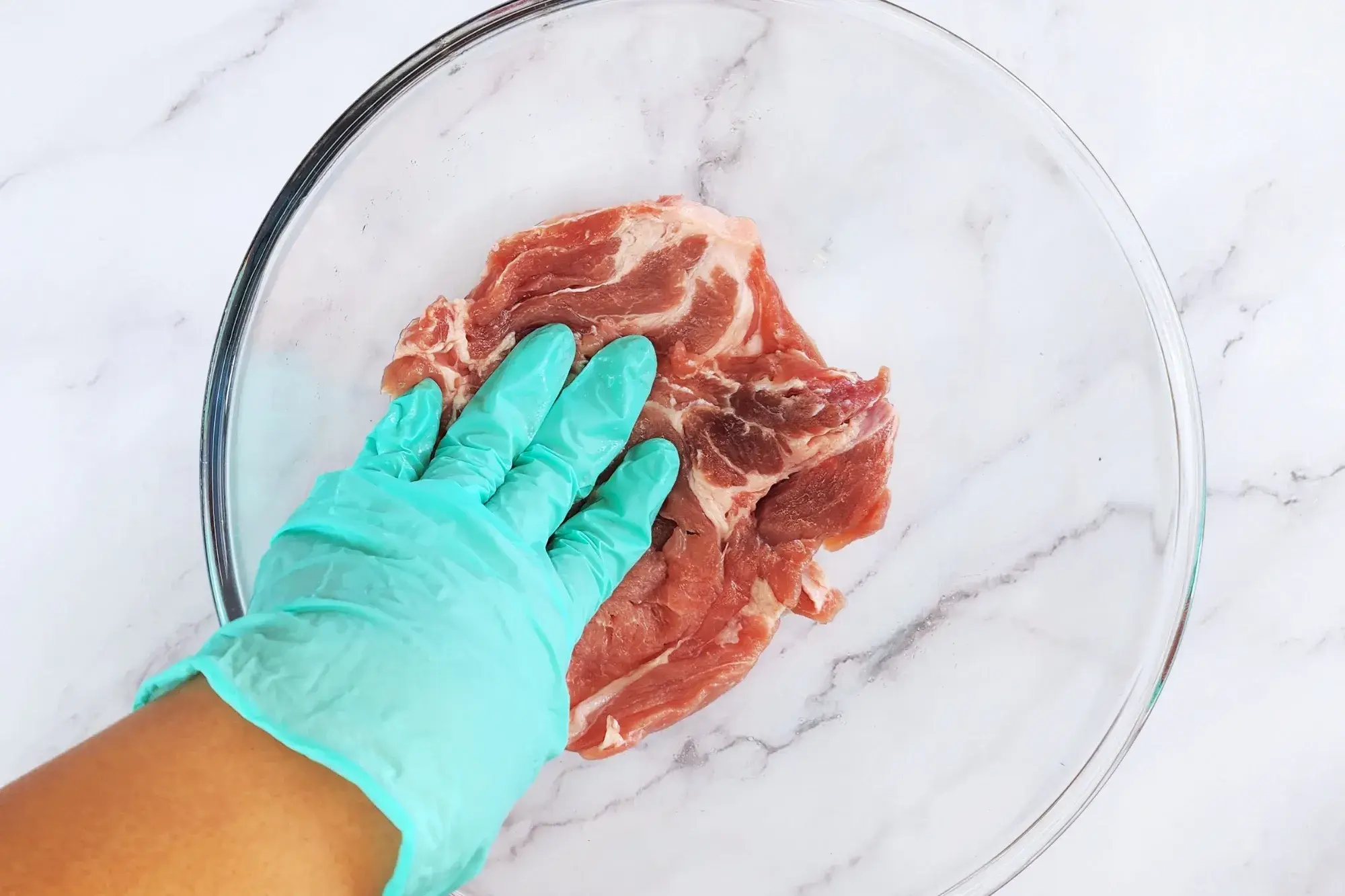 Massage the pork in until the liquid is absorbed