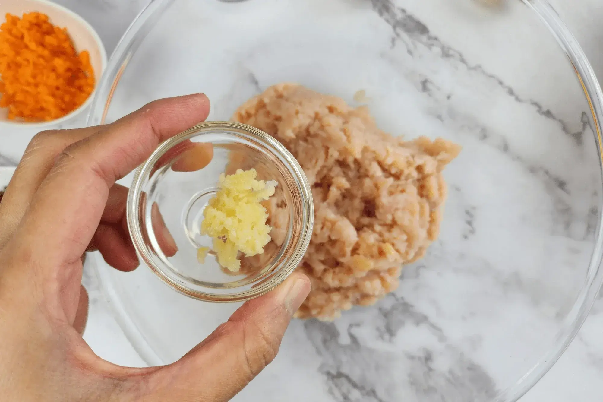 Mix ground chicken, minced garlic-stuffed peppers