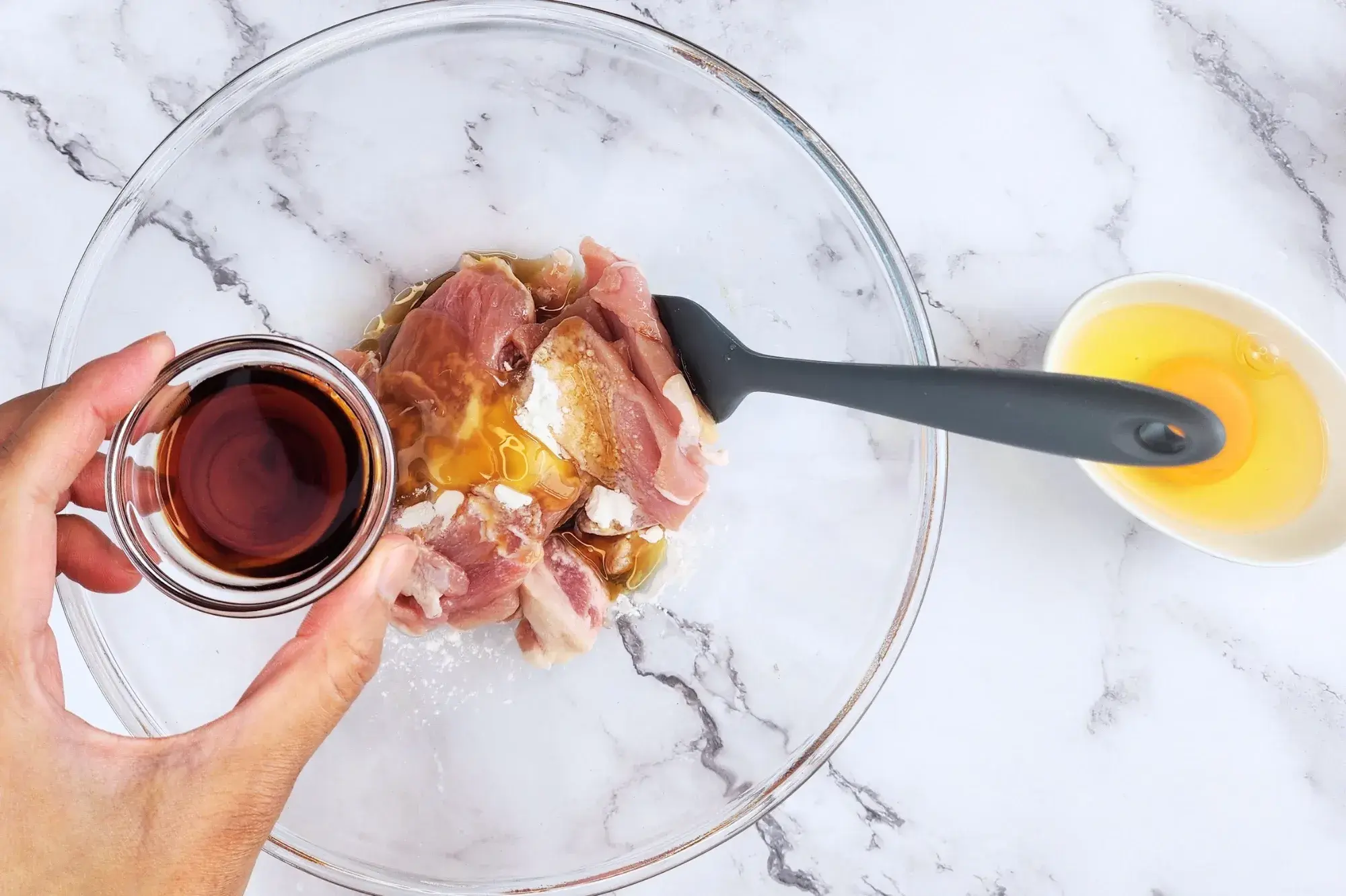 Mix sliced pork with tapioca starch, oyster sauce, light soy sauce, sesame oil