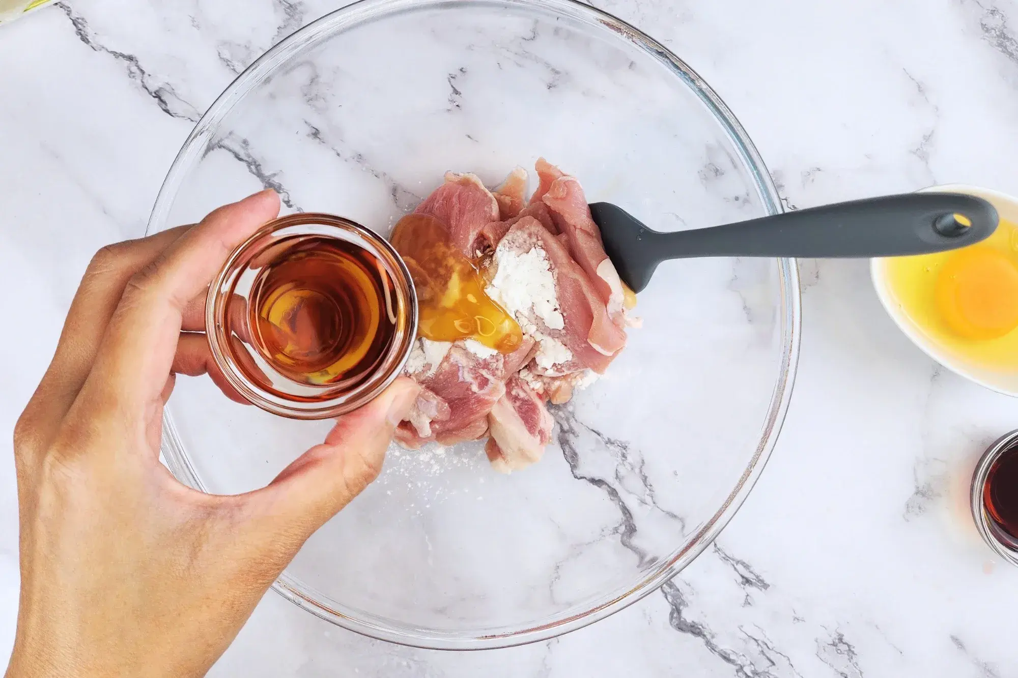 Mix sliced pork with tapioca starch, oyster sauce, light soy sauce