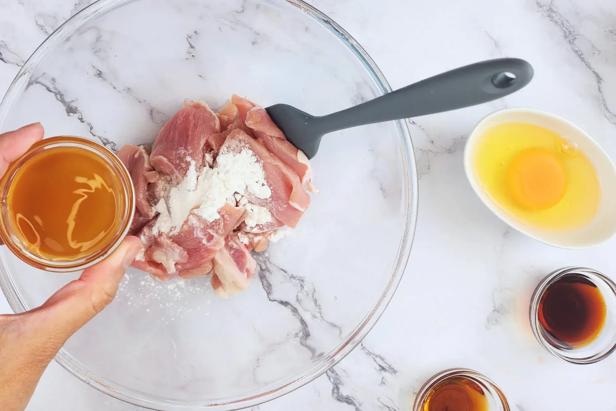 Mix sliced pork with tapioca starch, oyster sauce