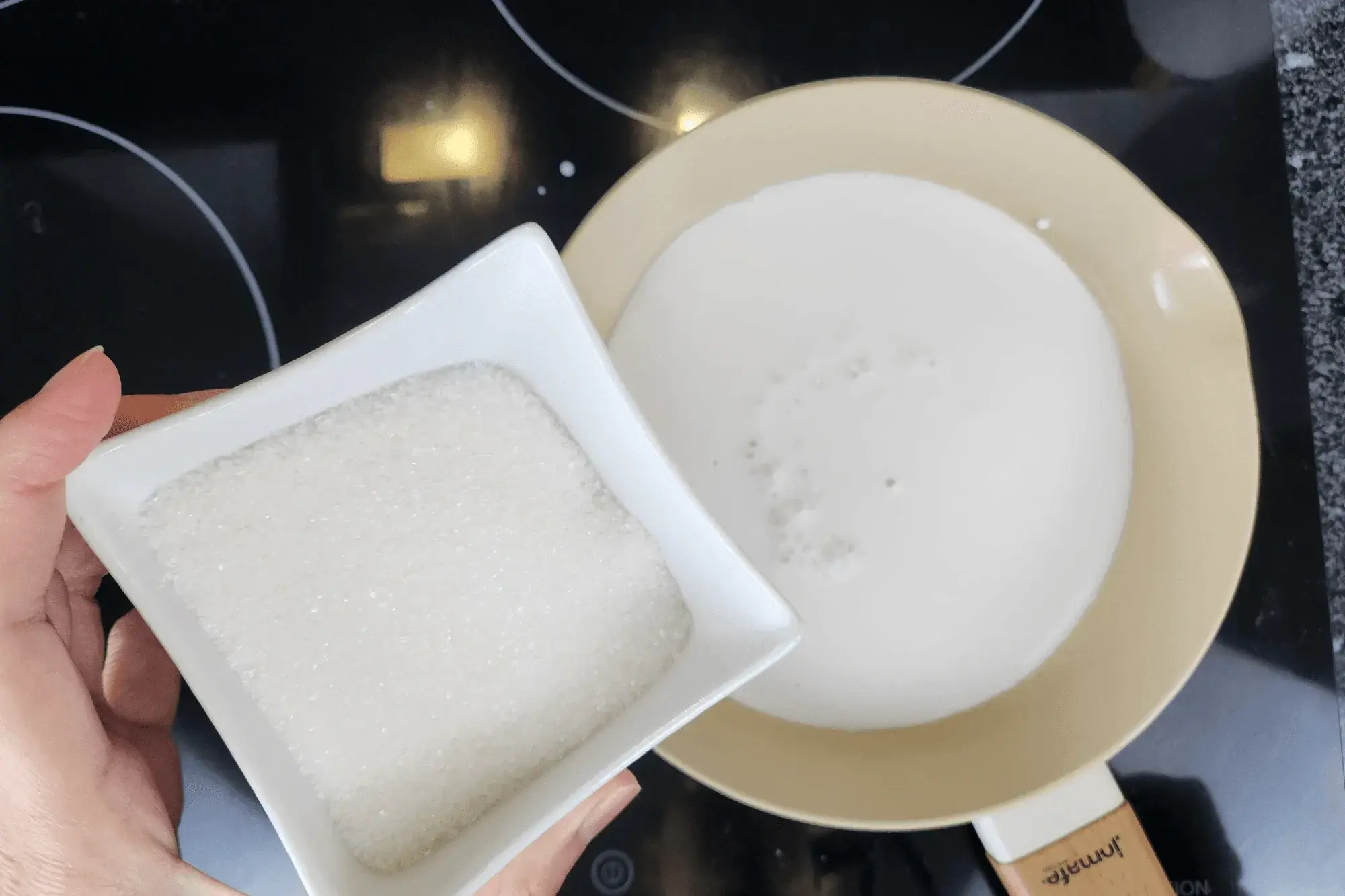 Mix sugar with coconut milk 