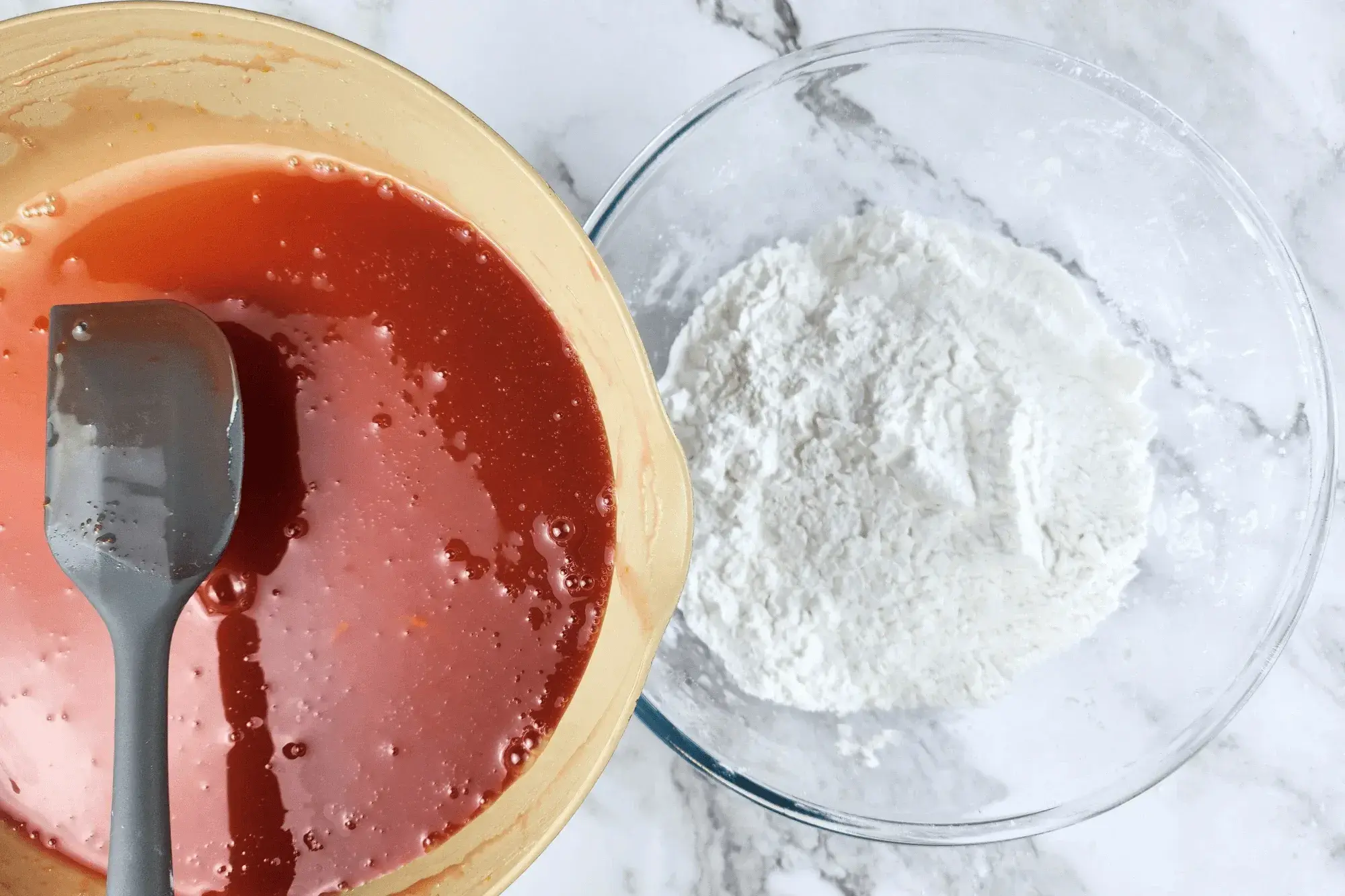 Pour mixed egg yolk with food coloring in tapioca flour bowl 