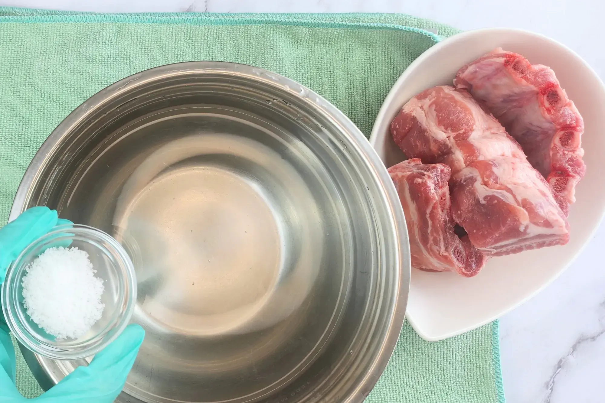 Rinse the pork ribs in salt water