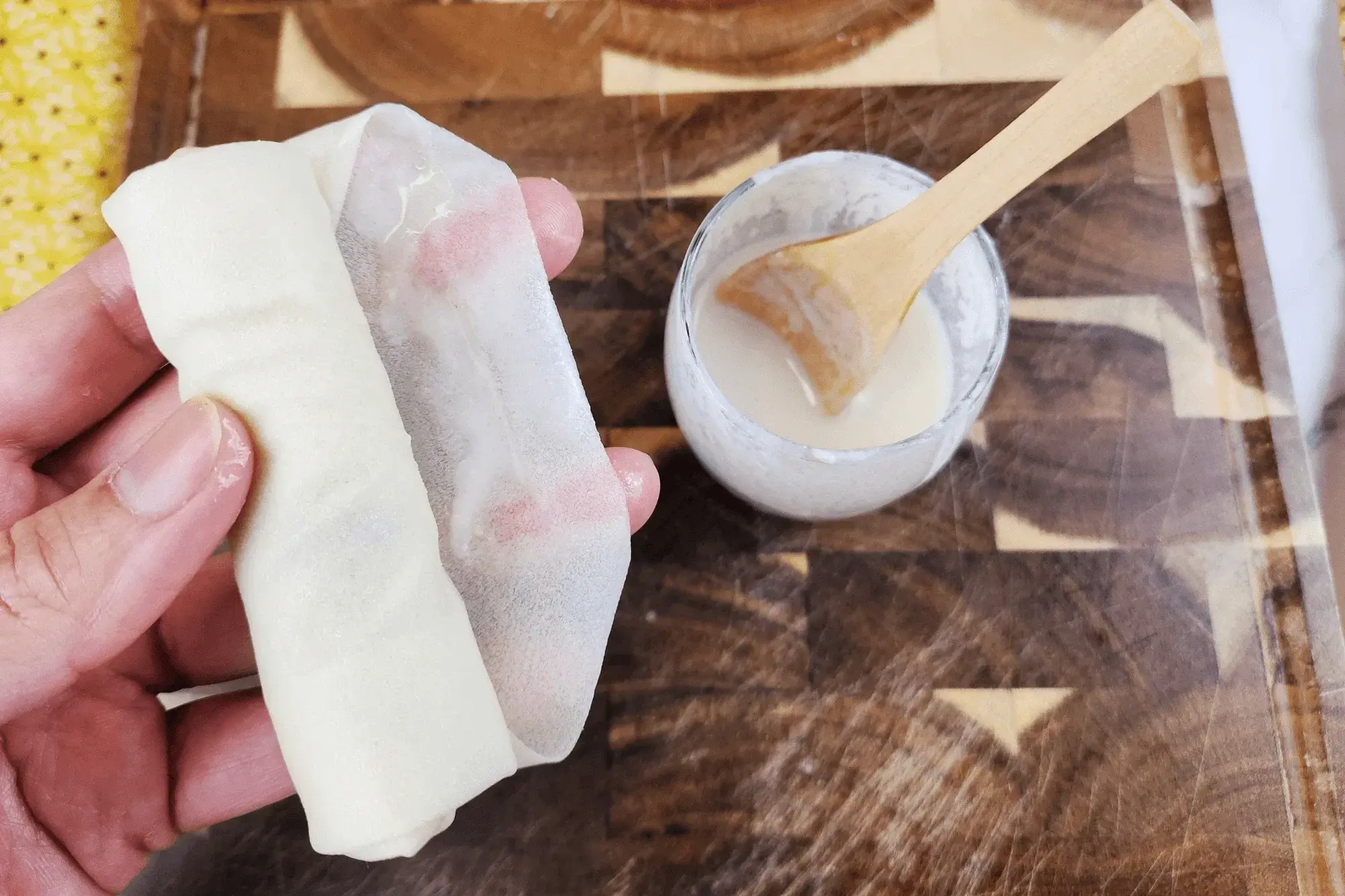 Roll tightly upward and seal the edge with a little flour paste.