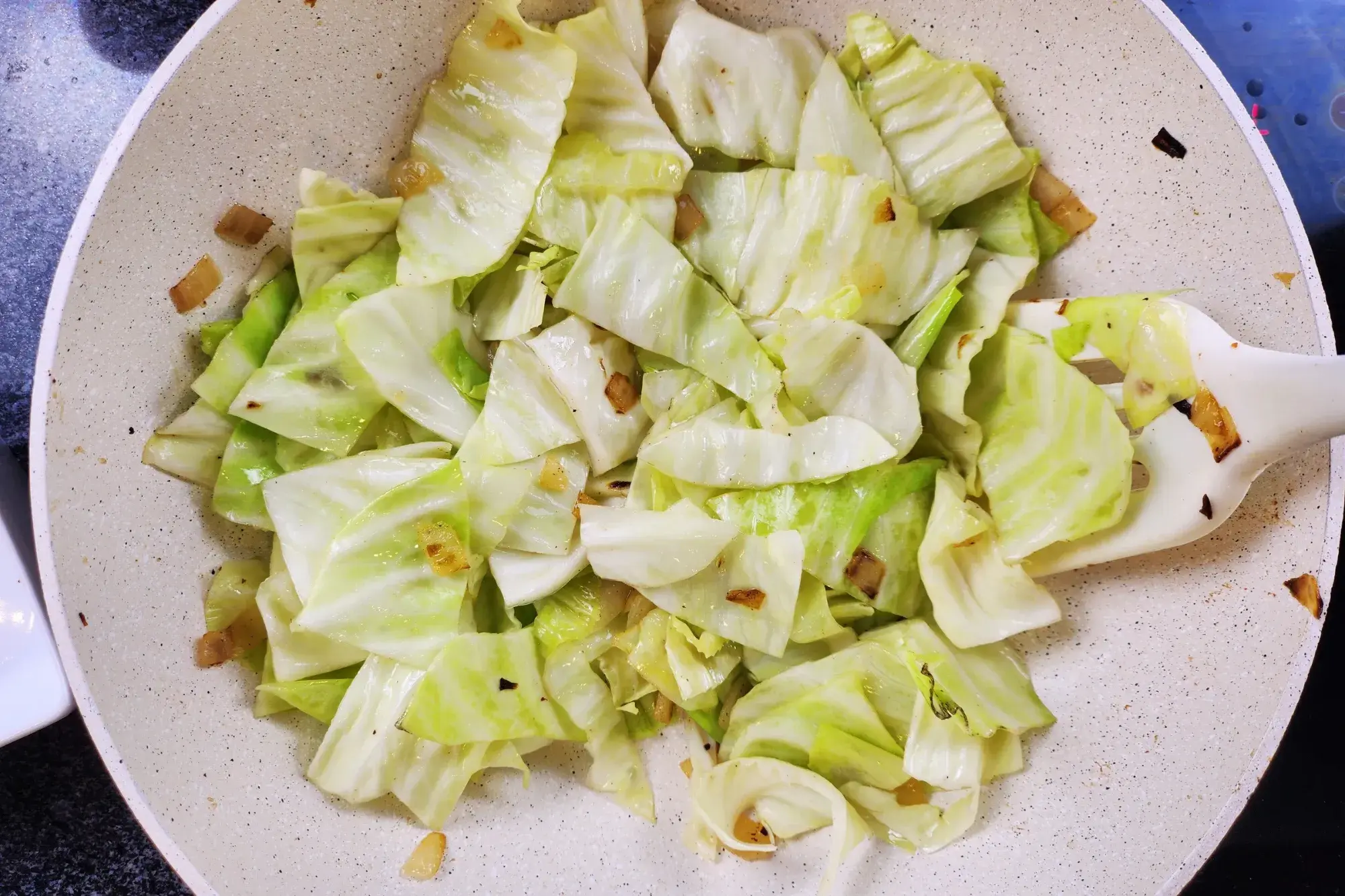 Sauté chopped cabbage  for 2–3 minutes.